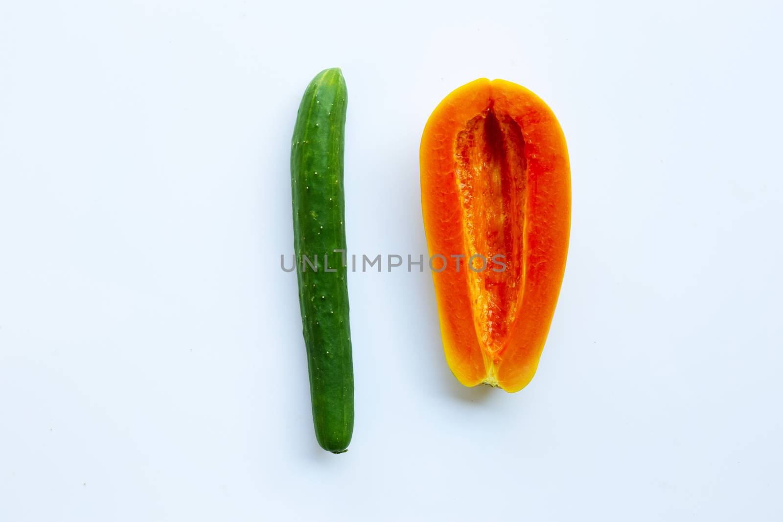 Cucumber and papaya on a white background. Sex concept