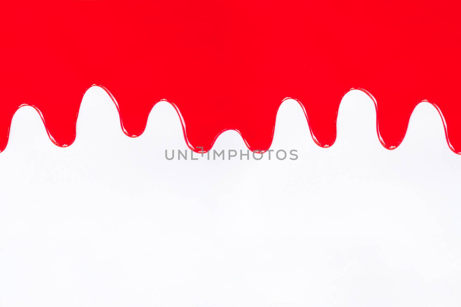 Red paint dripping on a white background
