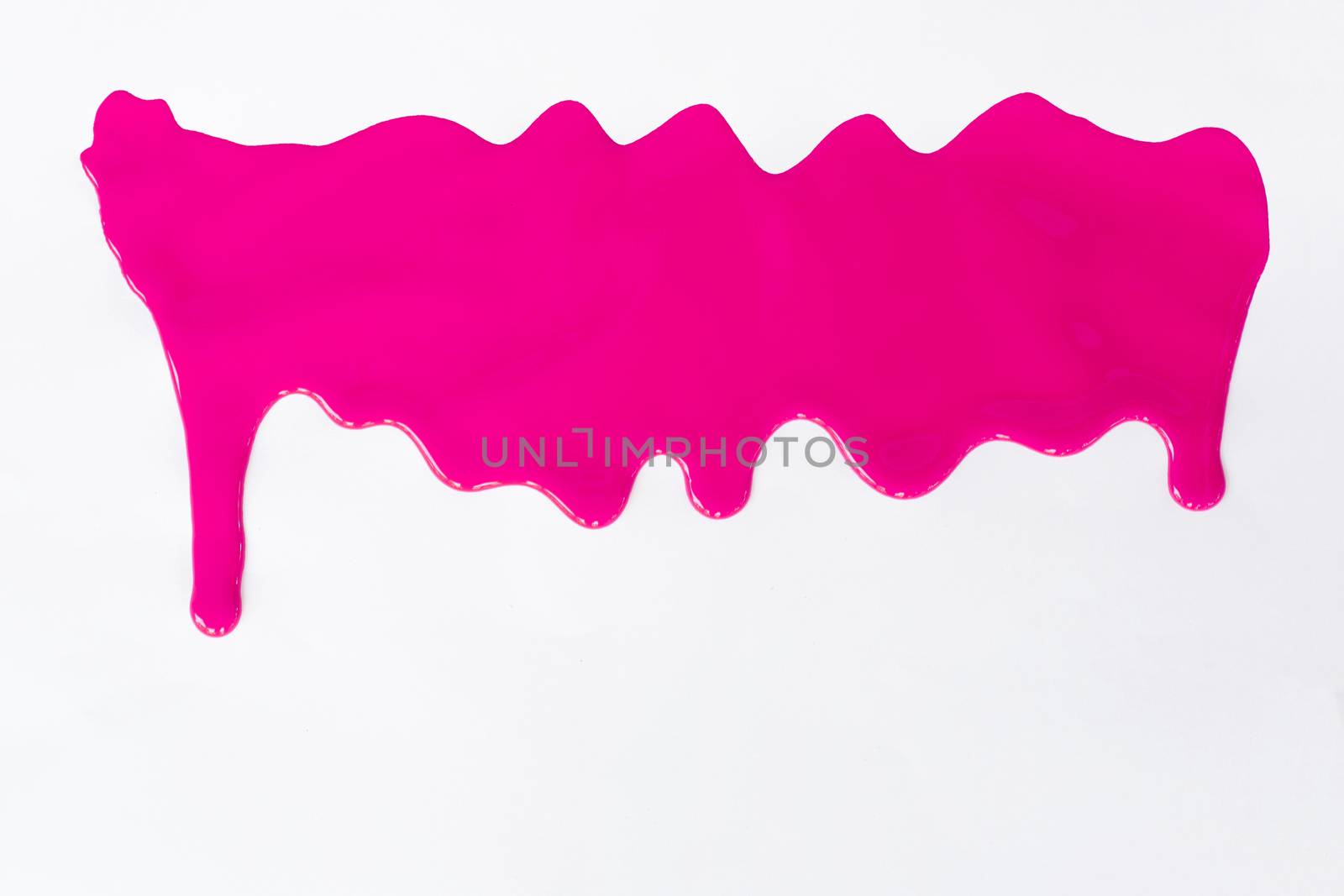 Pink paint dripping on a white background