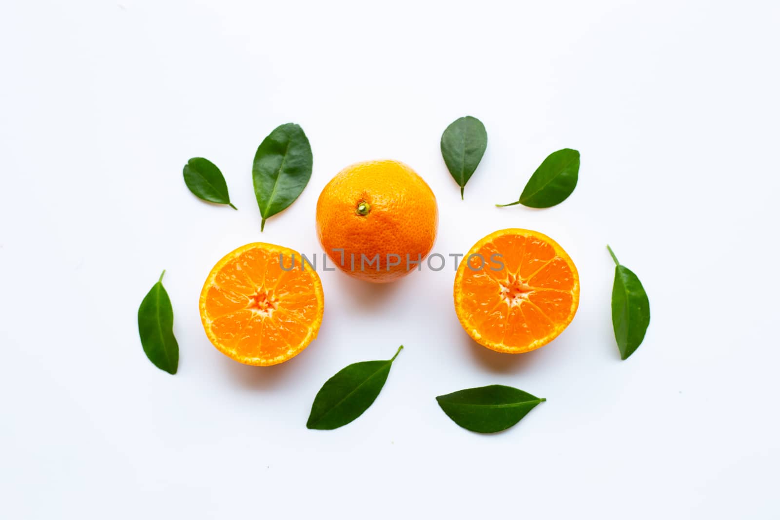 Orange fruits with leaves on white background. Top view