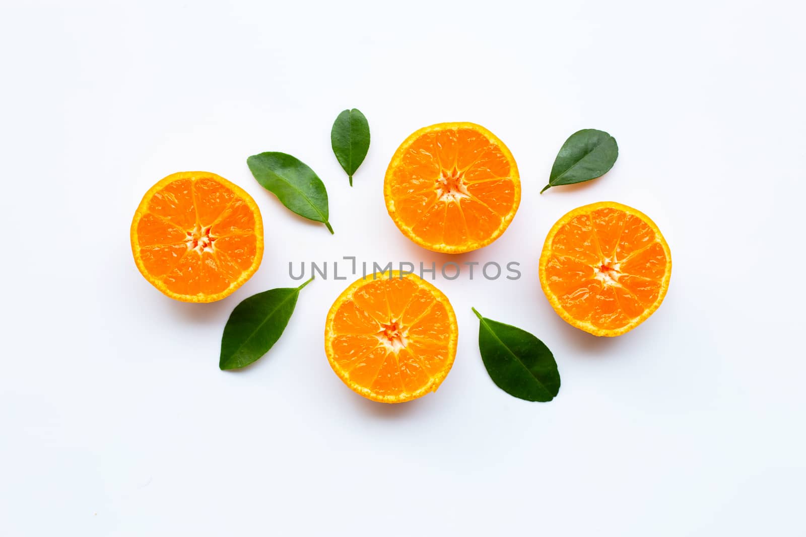 Orange fruits with leaves on white background. Top view