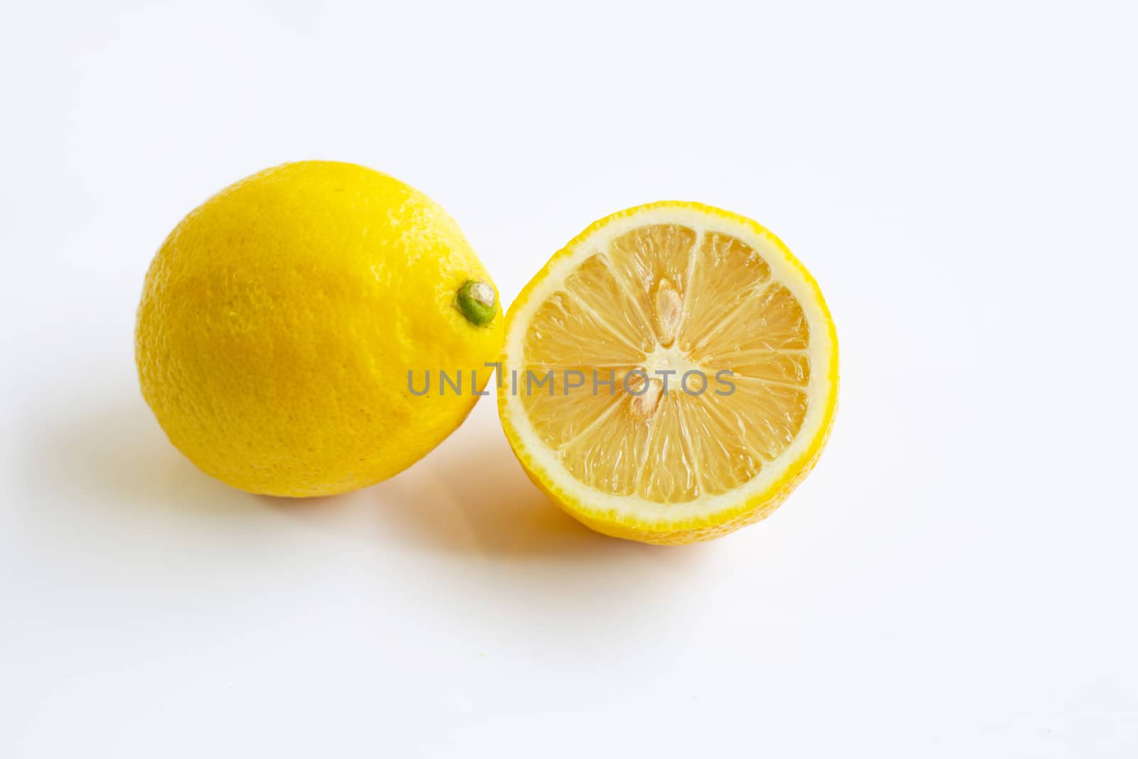 Ripe lemon on white background.