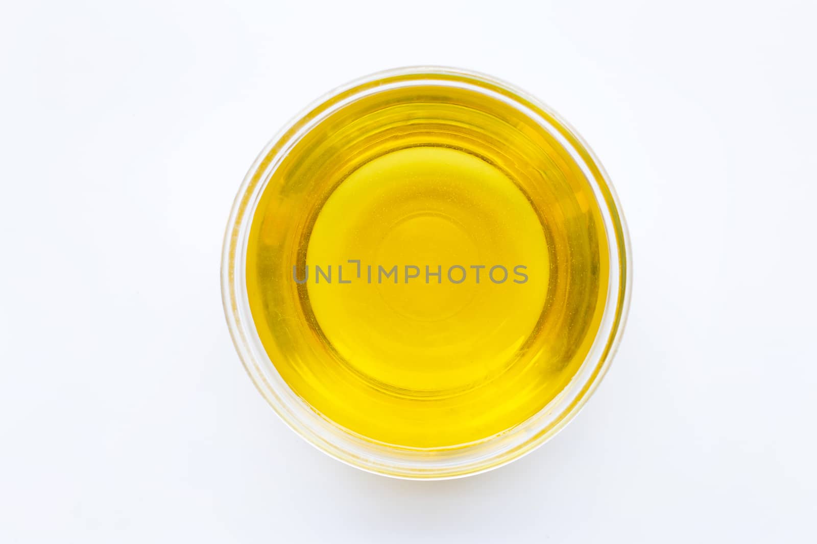 Olive oil bowl isolated on white. Top view