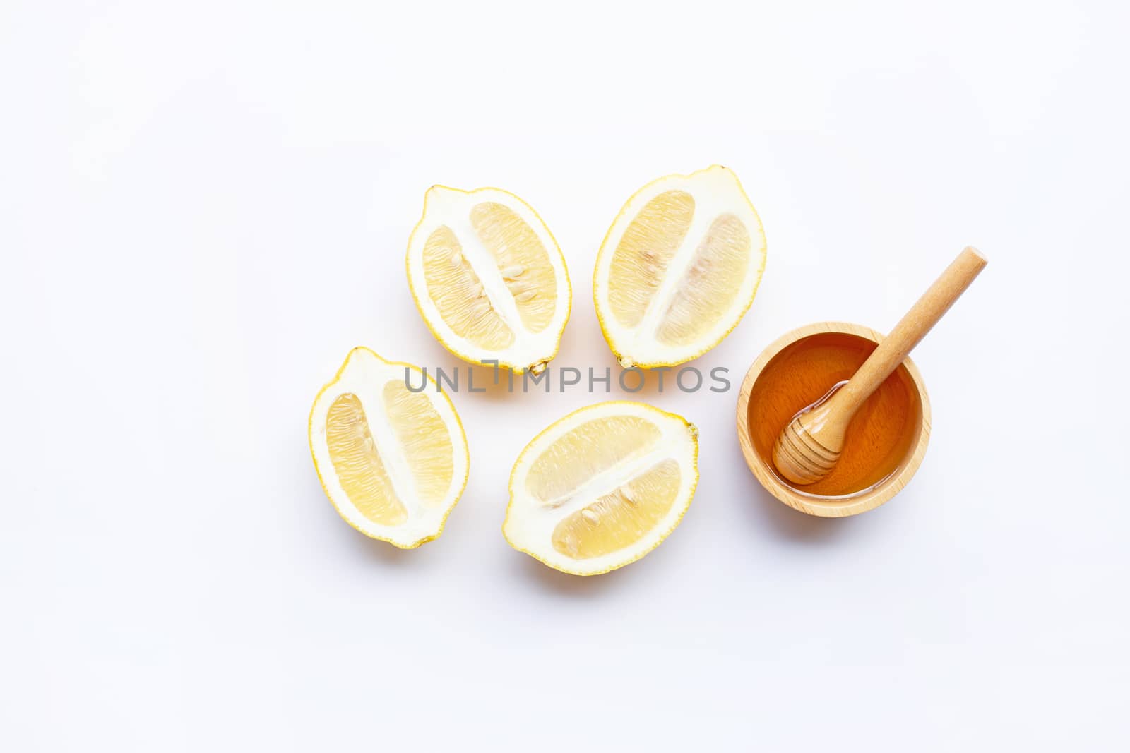 Honey with lemon on white background. Copy space