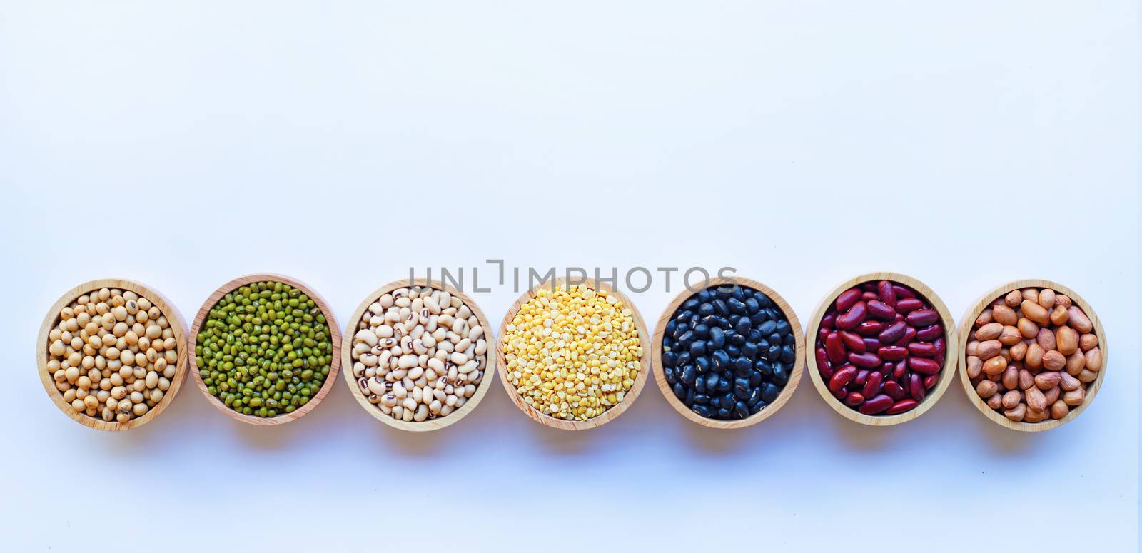 Mixed beans, Different legumes isolated on white background. by Bowonpat