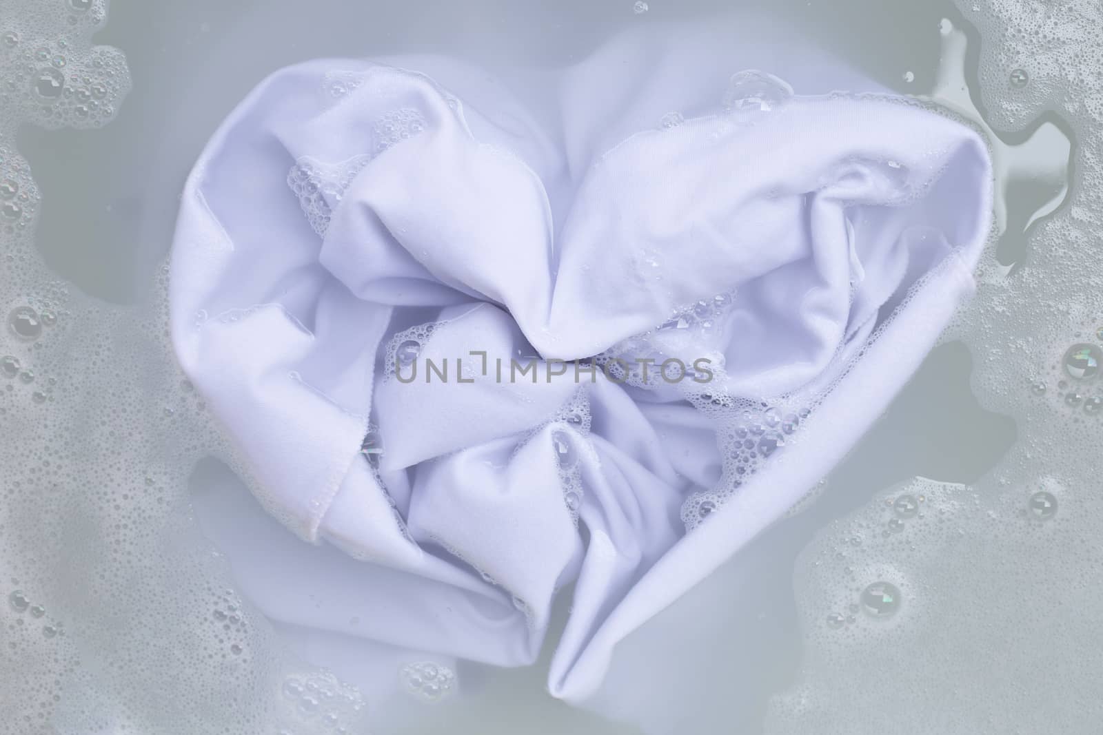 Soak a cloth before washing, white cloth, Heart shape by Bowonpat