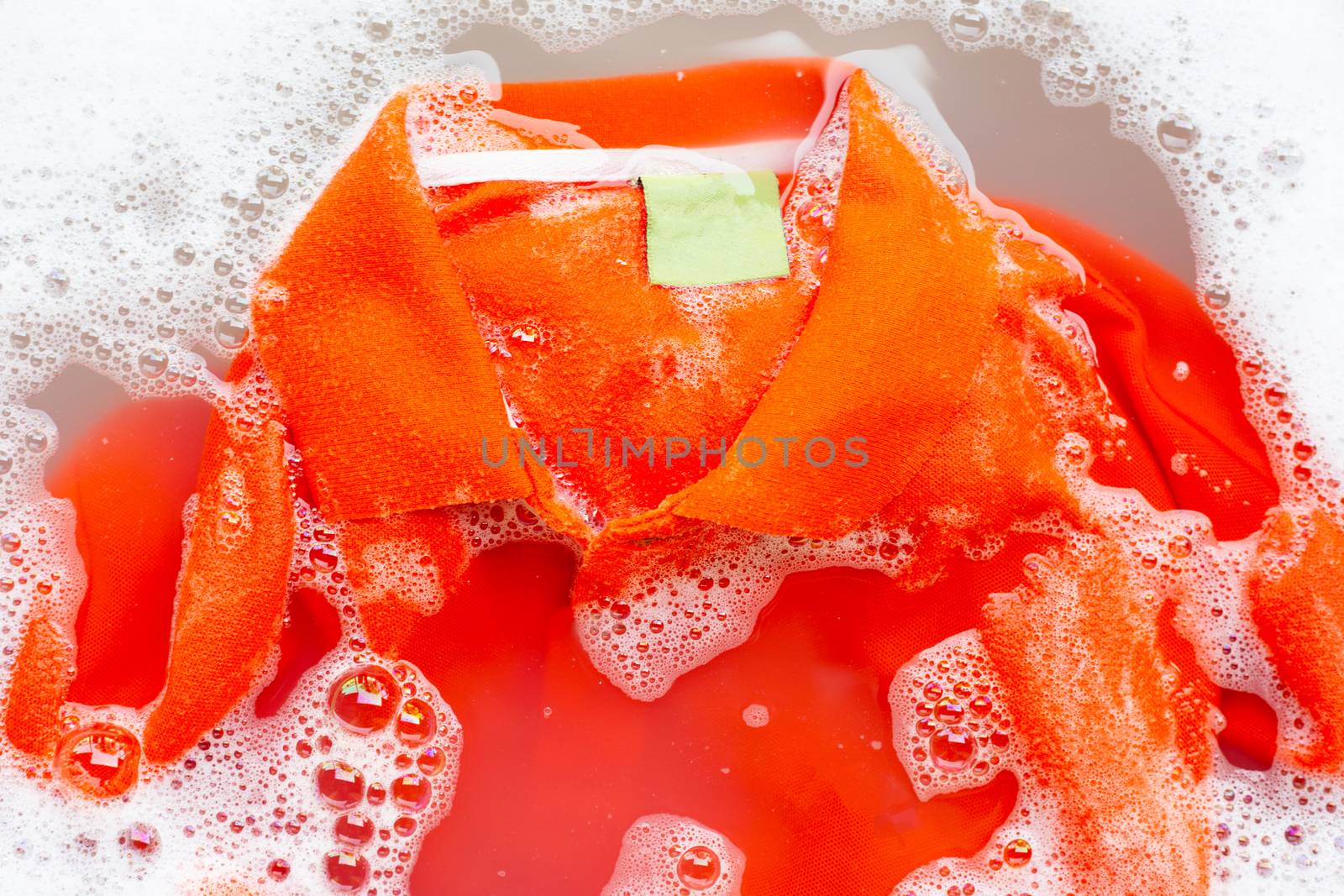 Soak a cloth before washing, Orange polo shirt