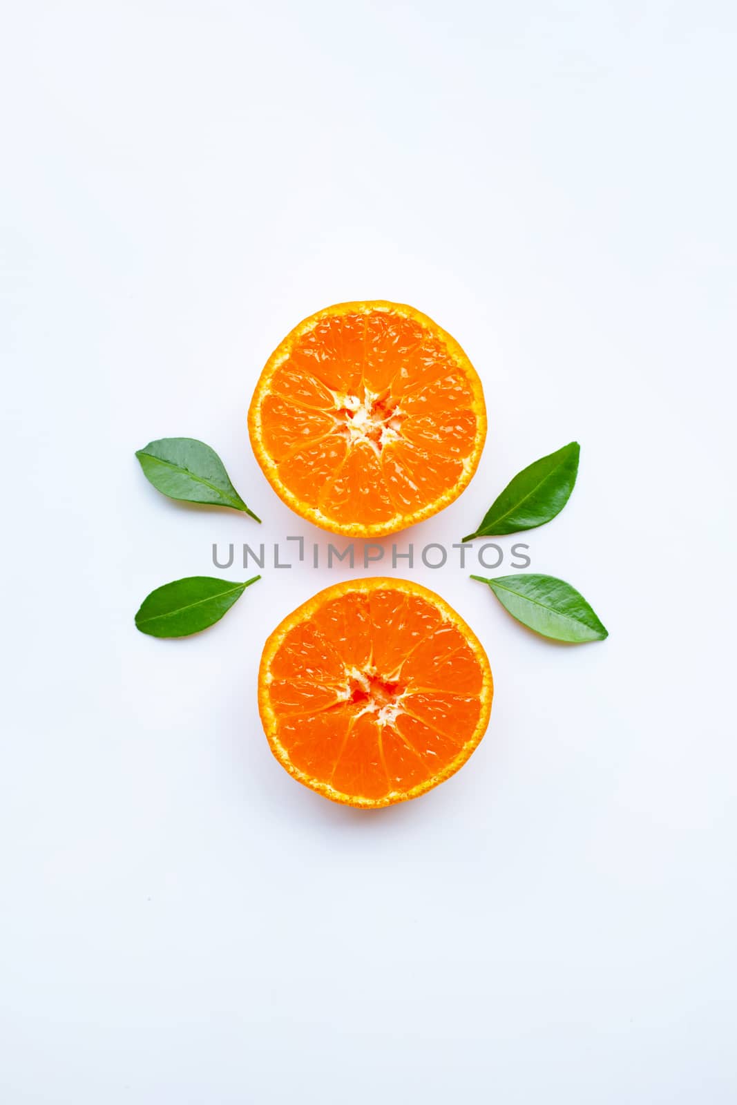 Orange fruits and green leaves on a white background.  by Bowonpat