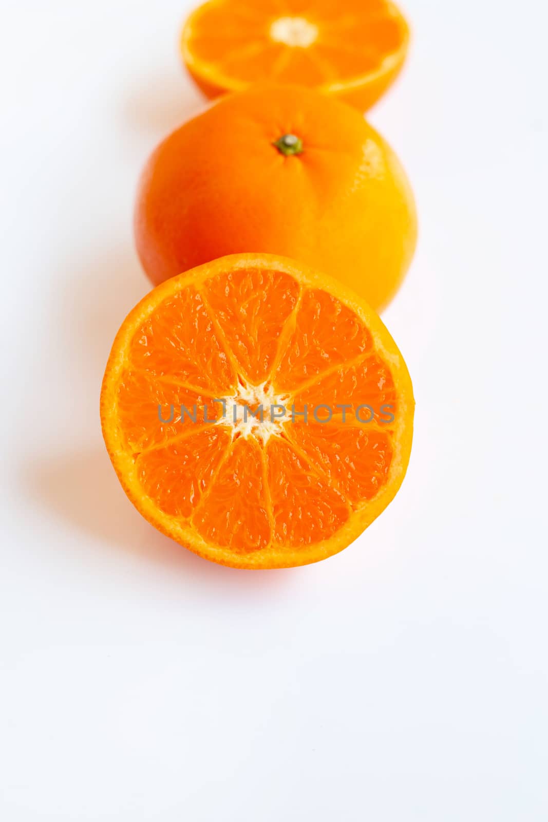 Fresh orange citrus fruit on white. by Bowonpat