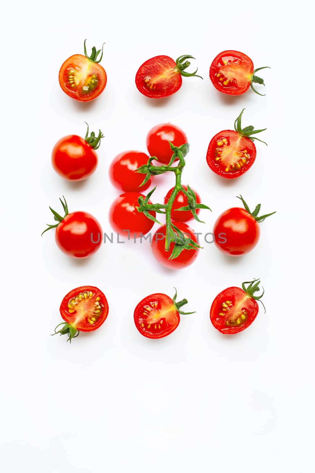 Fresh tomatoes, whole and half cut isolated on white background. by Bowonpat