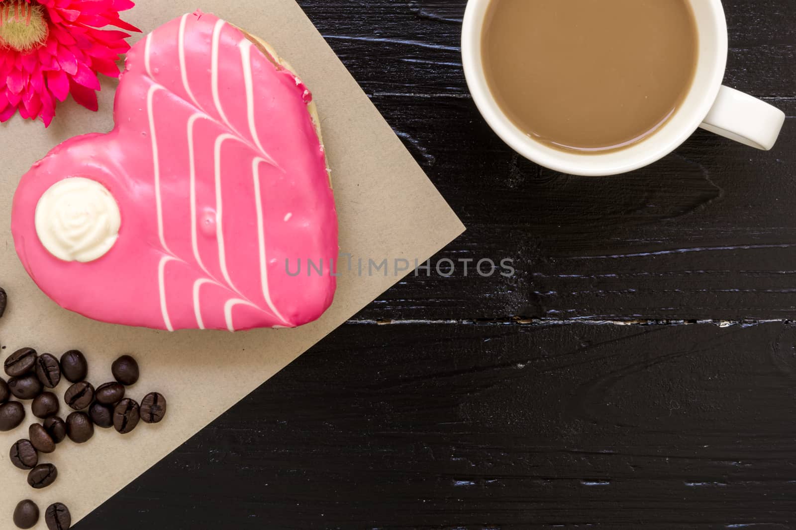 Fresh donut or doughnut with cup of hot coffee for relaxing moment.