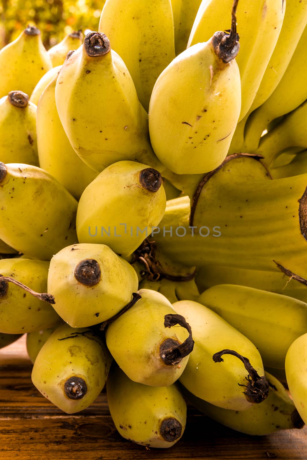 Bunch of ripe banana on wooden background.