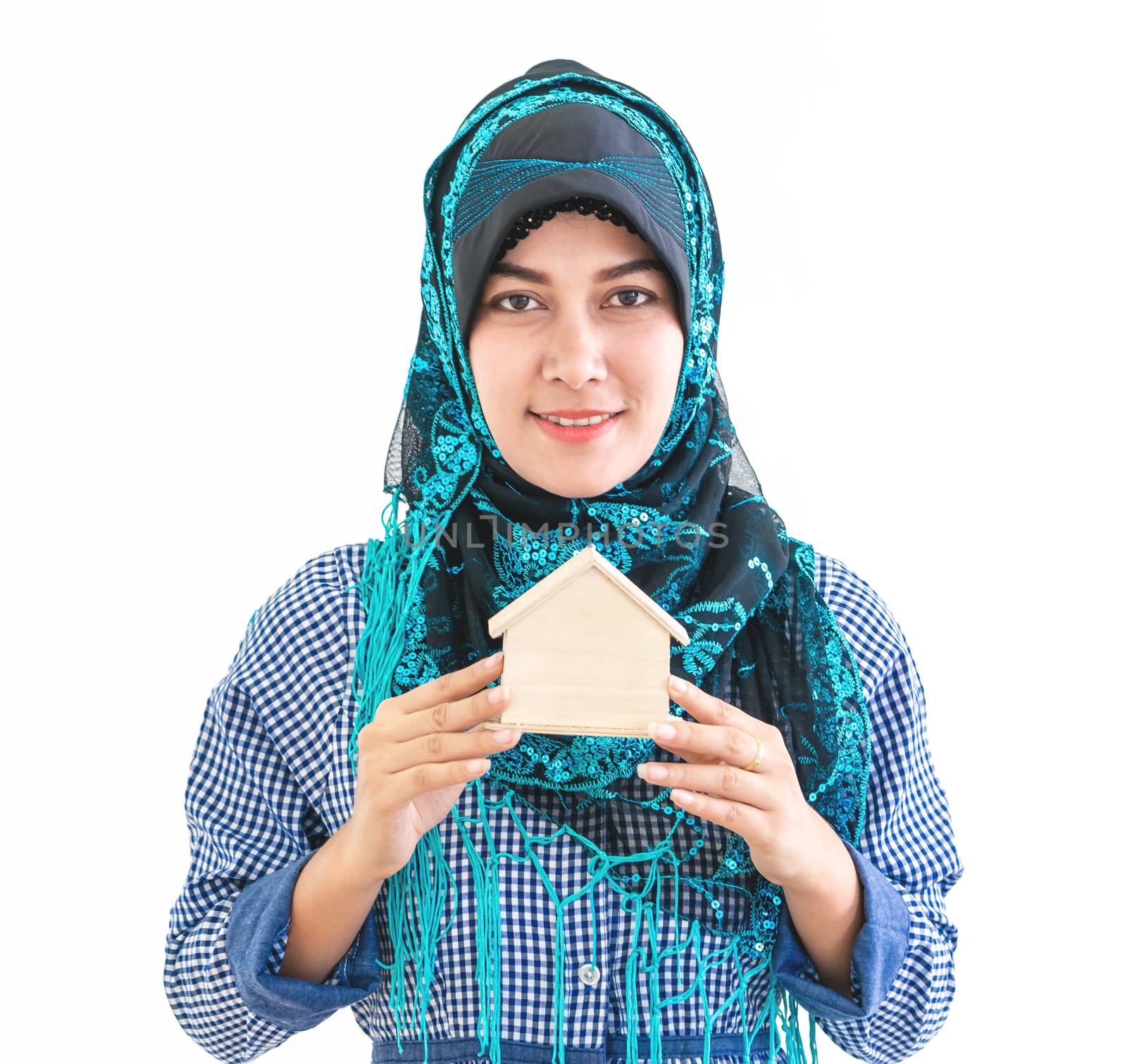 Muslim Woman is holding a house model for housing concept by junce