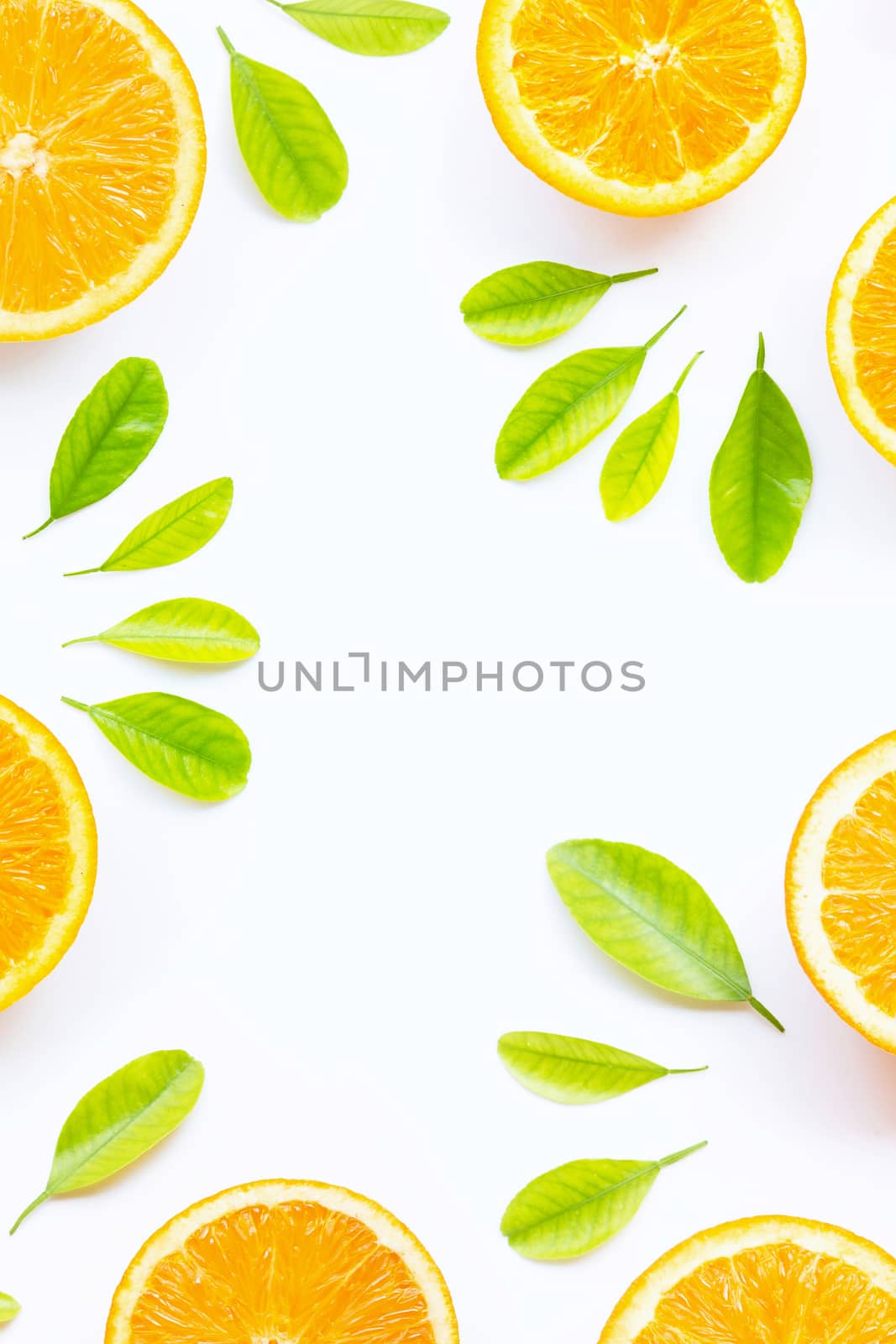 Orange with green leaves isolated on white background. Copy space