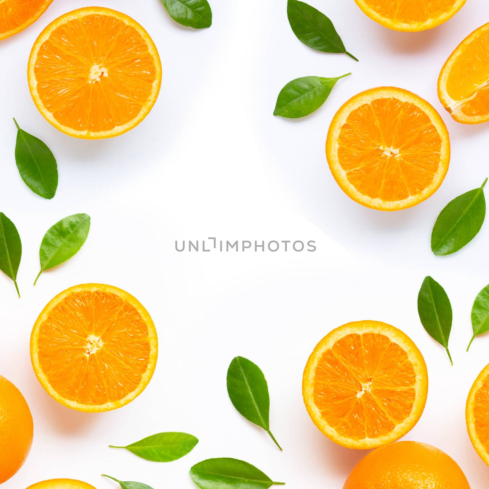 Frame made of fresh orange citrus fruit with leaves isolated on white background. Juicy and sweet. Copy space