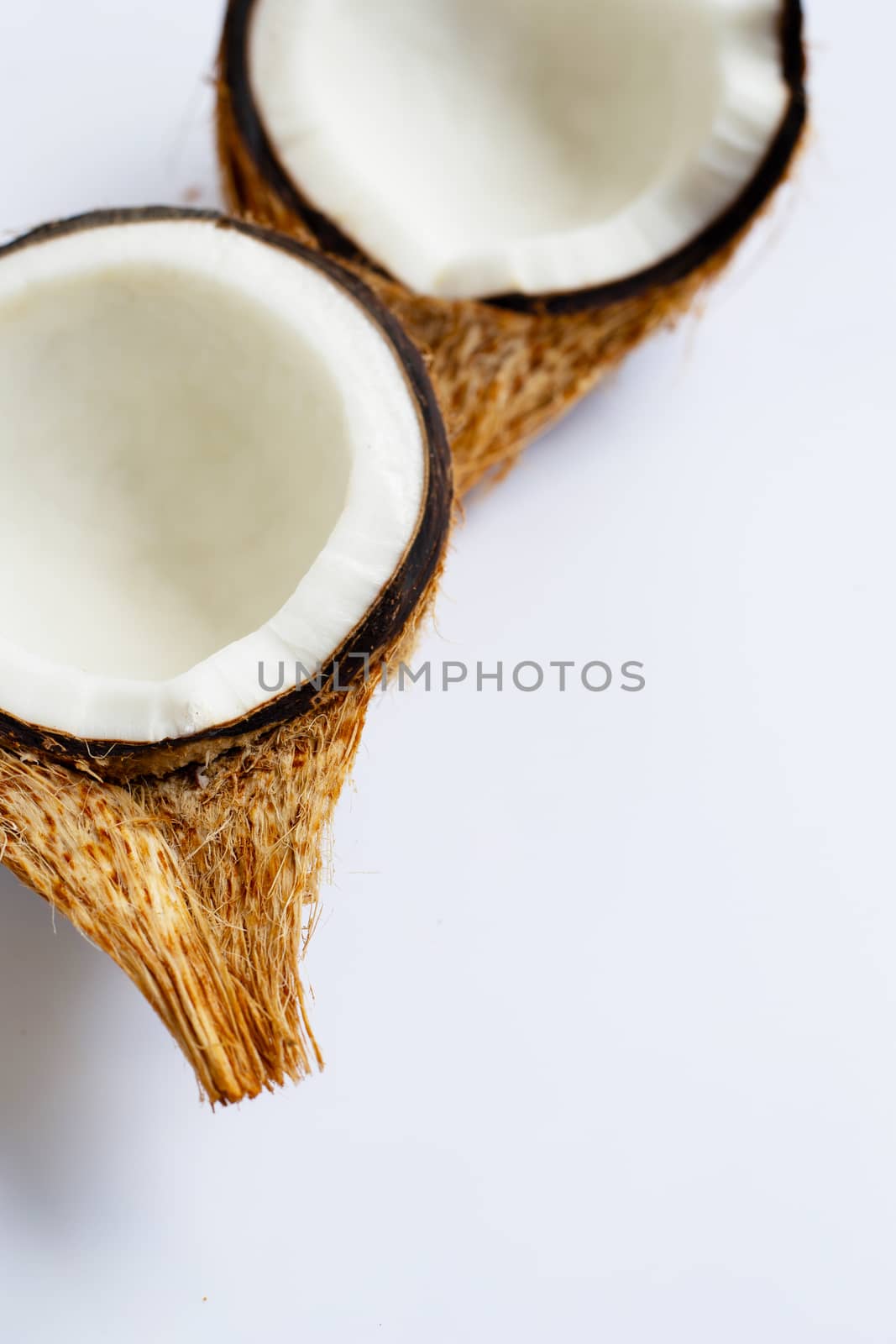 Ripe coconuts on white background. Top view of tropical fruit.