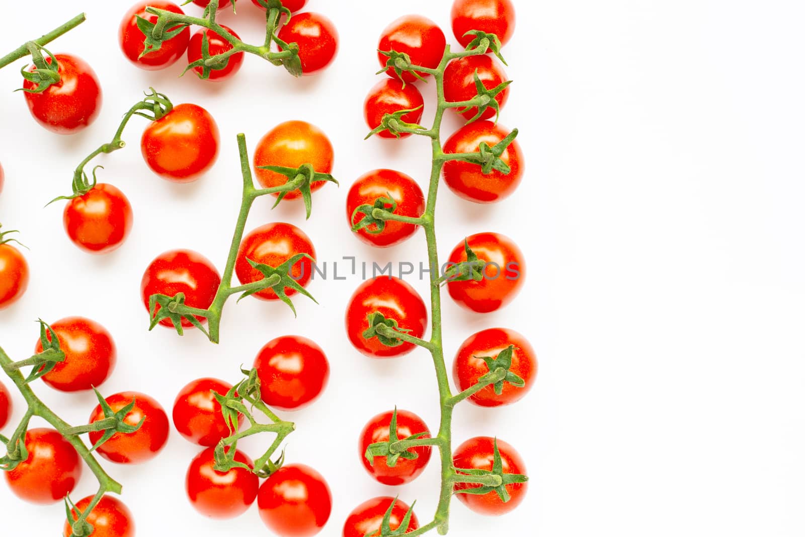 Fresh cherry tomatoes isolated on white background. Copy space