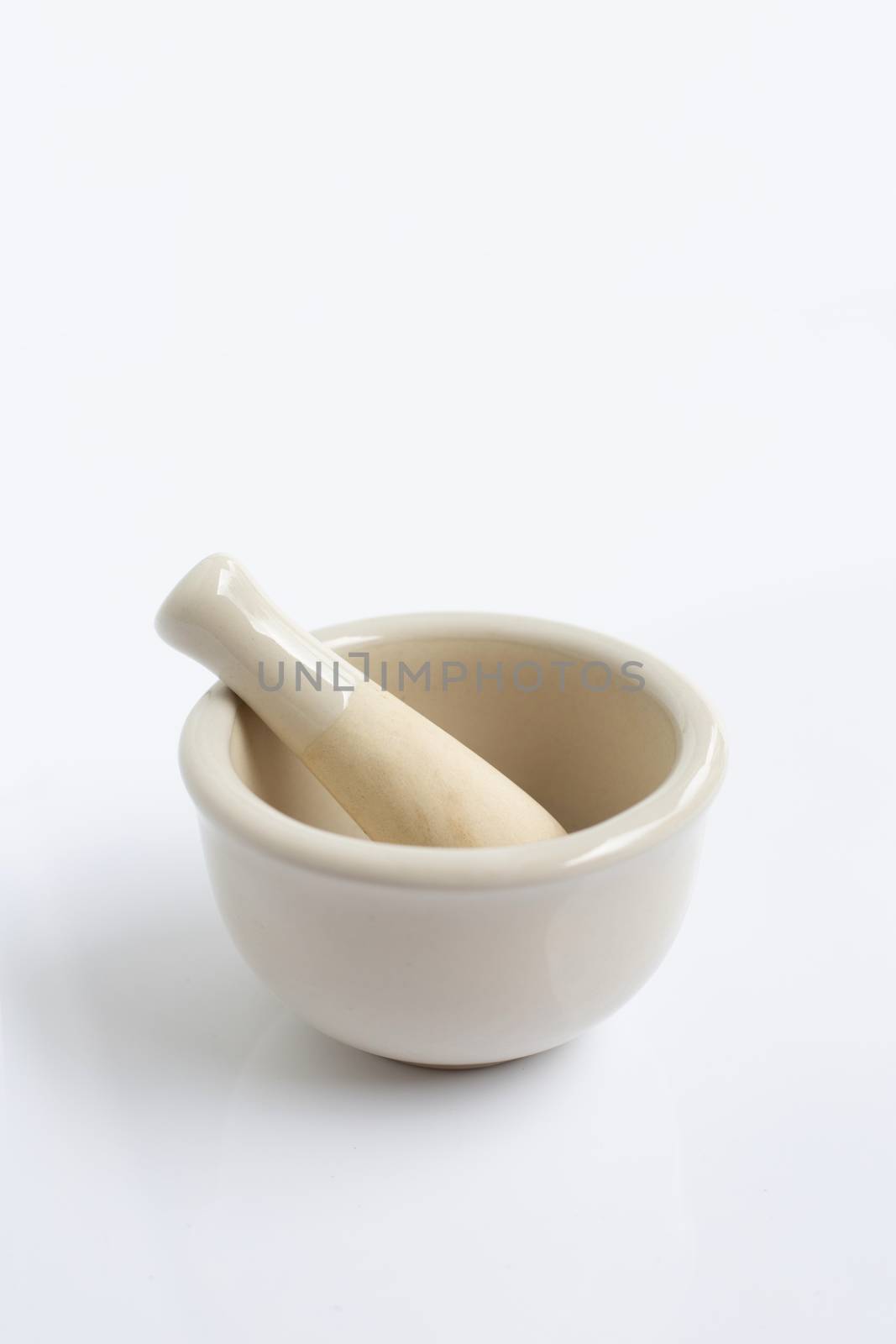 Mortar and pestle on white background.