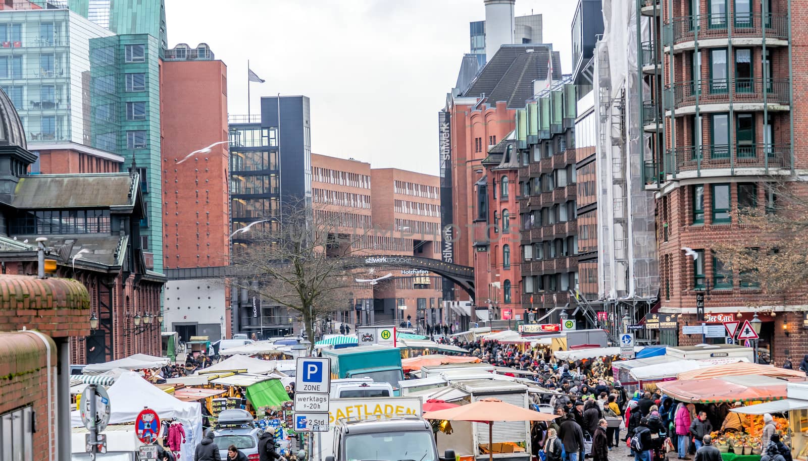 Hamburg, Germany, December 10th 2017: View over the fish market of Hamburg with market stalls and people on the Elbe Strait in Altona