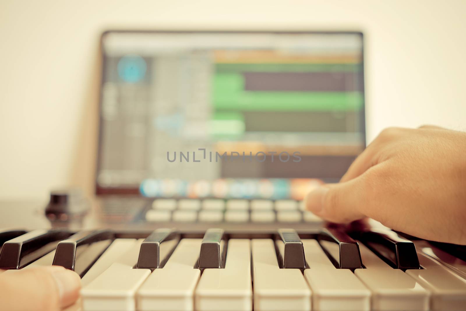 Music keyboard player is recording song on computer DAW music st by junce