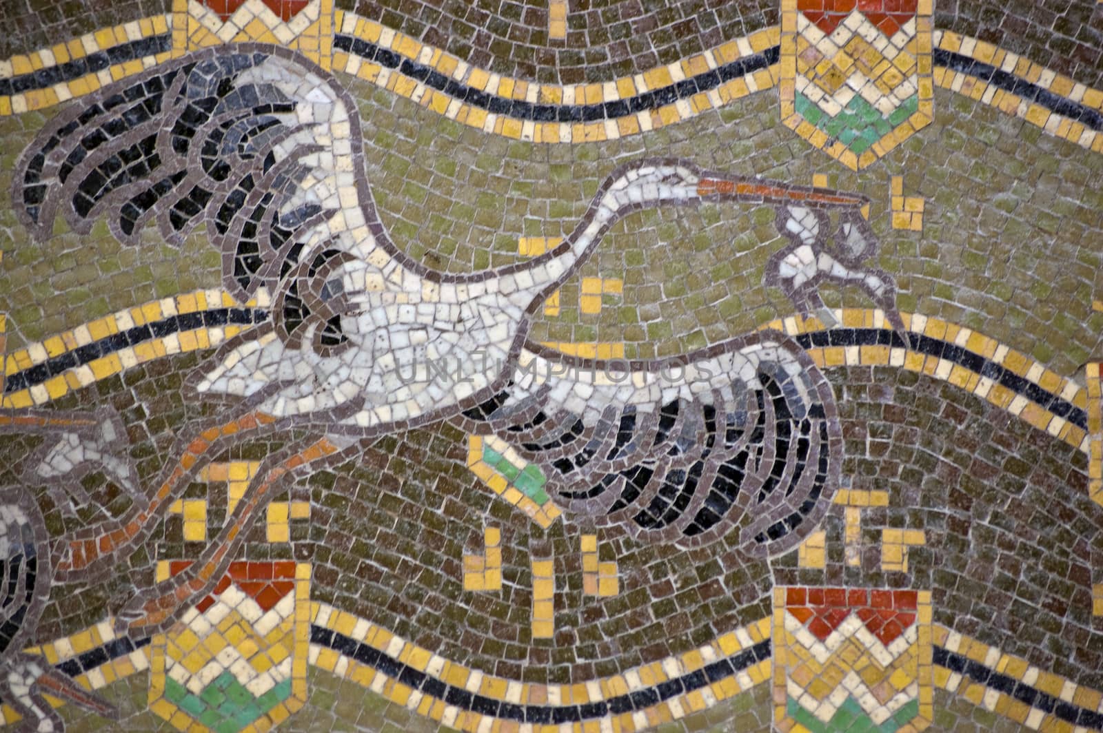 Mosaic showing white storks flying. Latin name for the bird is Ciconia ciconia. Outside wall of the Hungarian Pavilion, Giardini, Venice. Building open to the public to exhibit during the Biennale.