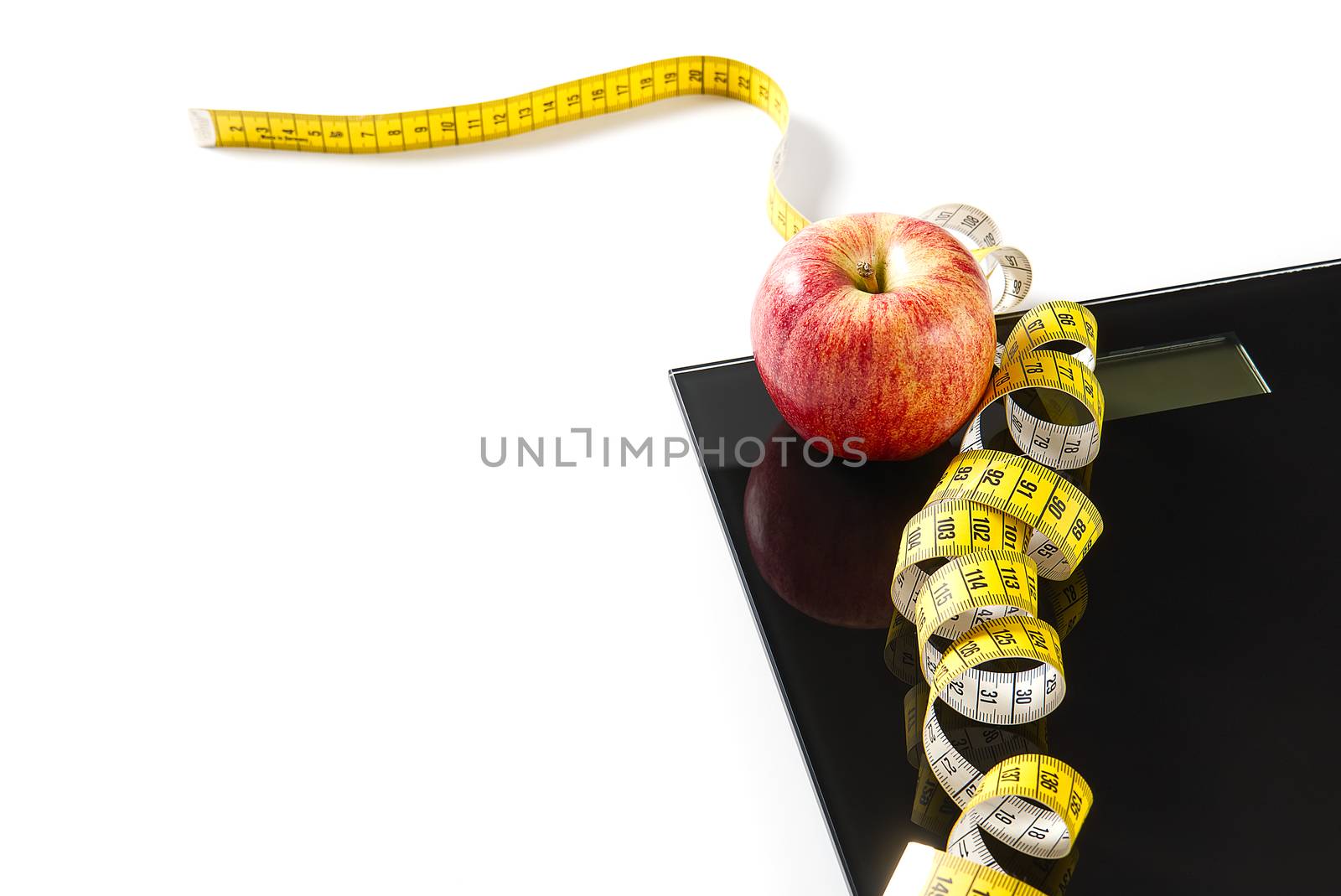 Diet plan, menu or program, tape measure, diet food of fresh fruits on white background, weight loss and detox concept, top view. weight loss concept. Apple and measuring tape. Diet. by PhotoTime