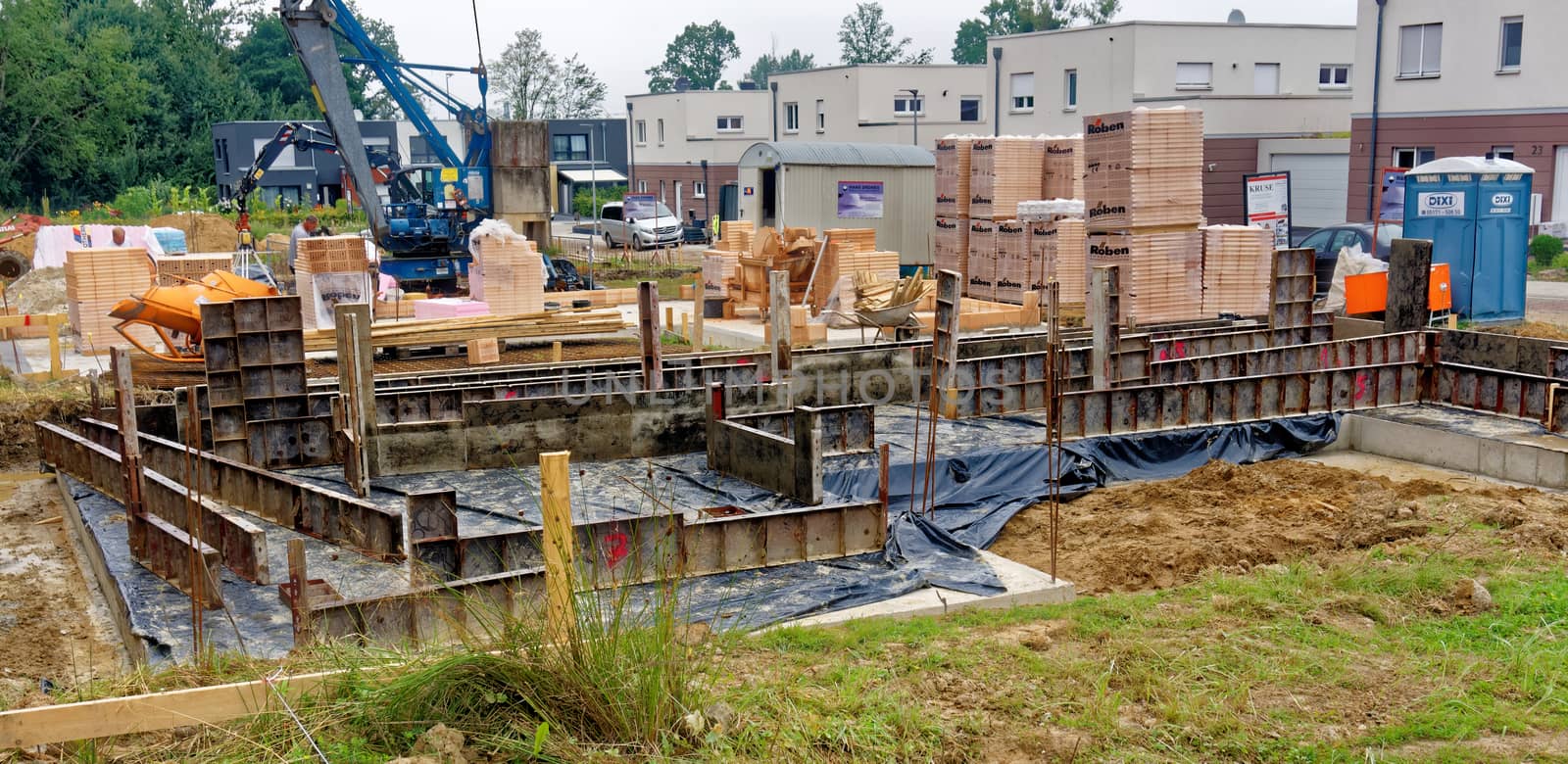 Wolfsburg, Lower Saxony, Germany, August 17,2017: Construction site with casing for the construction of a new single-family house on a clay site with high water level.