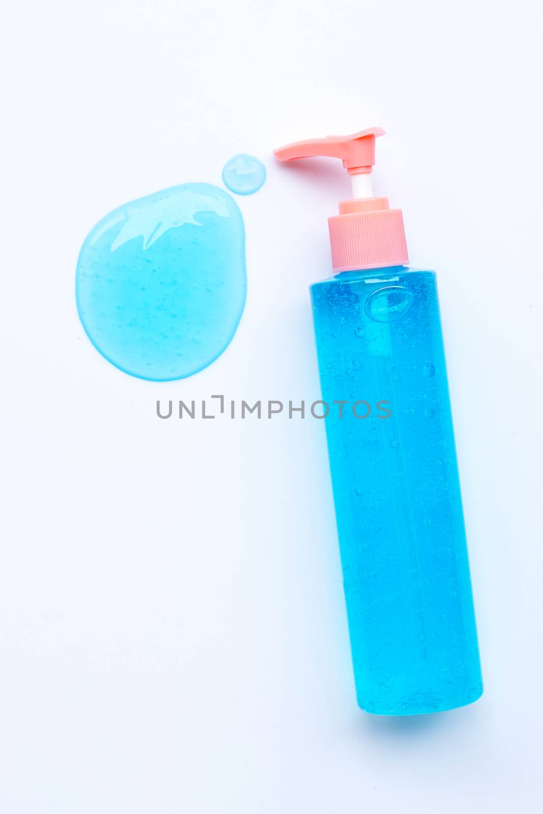 Alcohol hand sanitizer gel in pump bottle on white background. Copy space