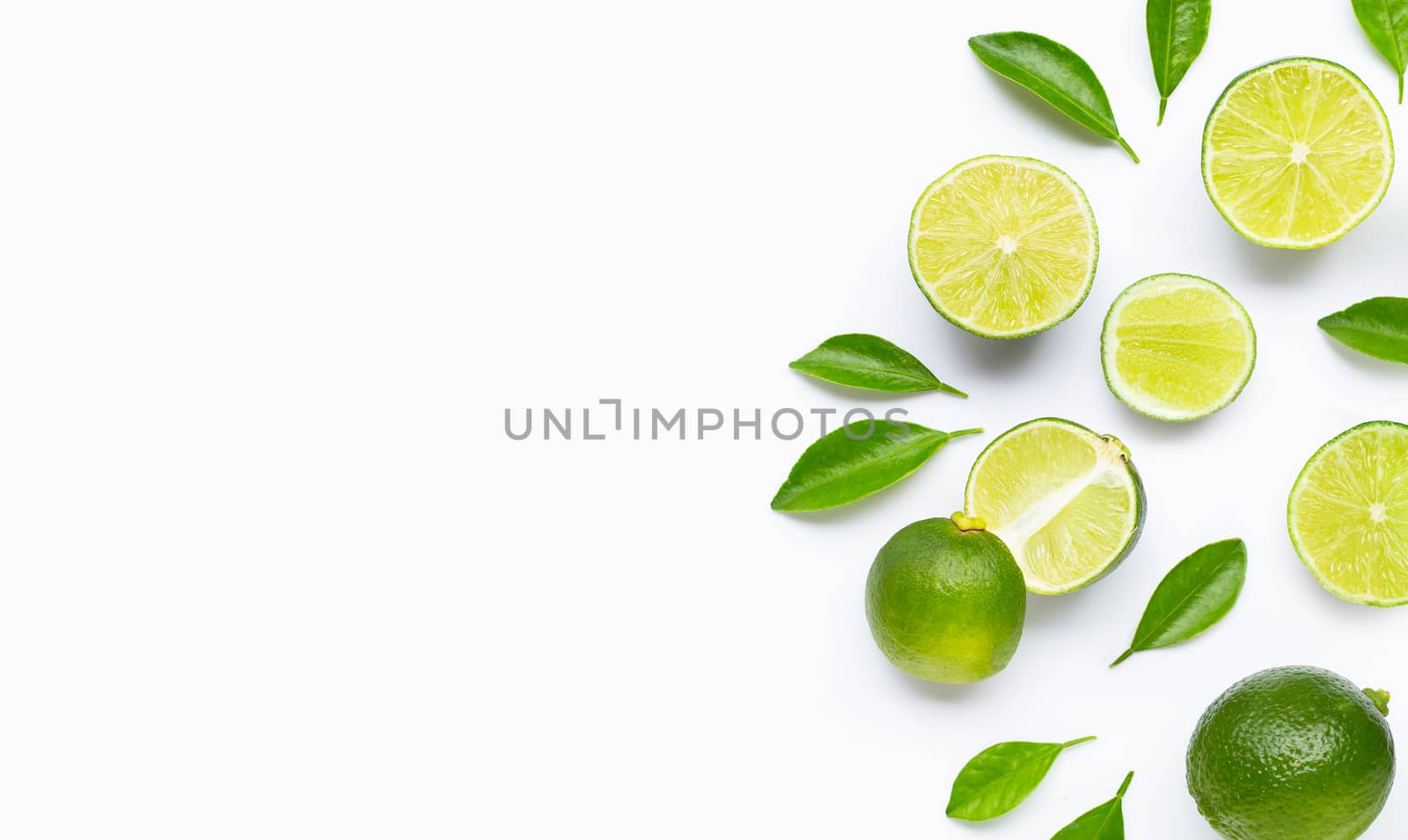 Limes with leaves isolated on white background.