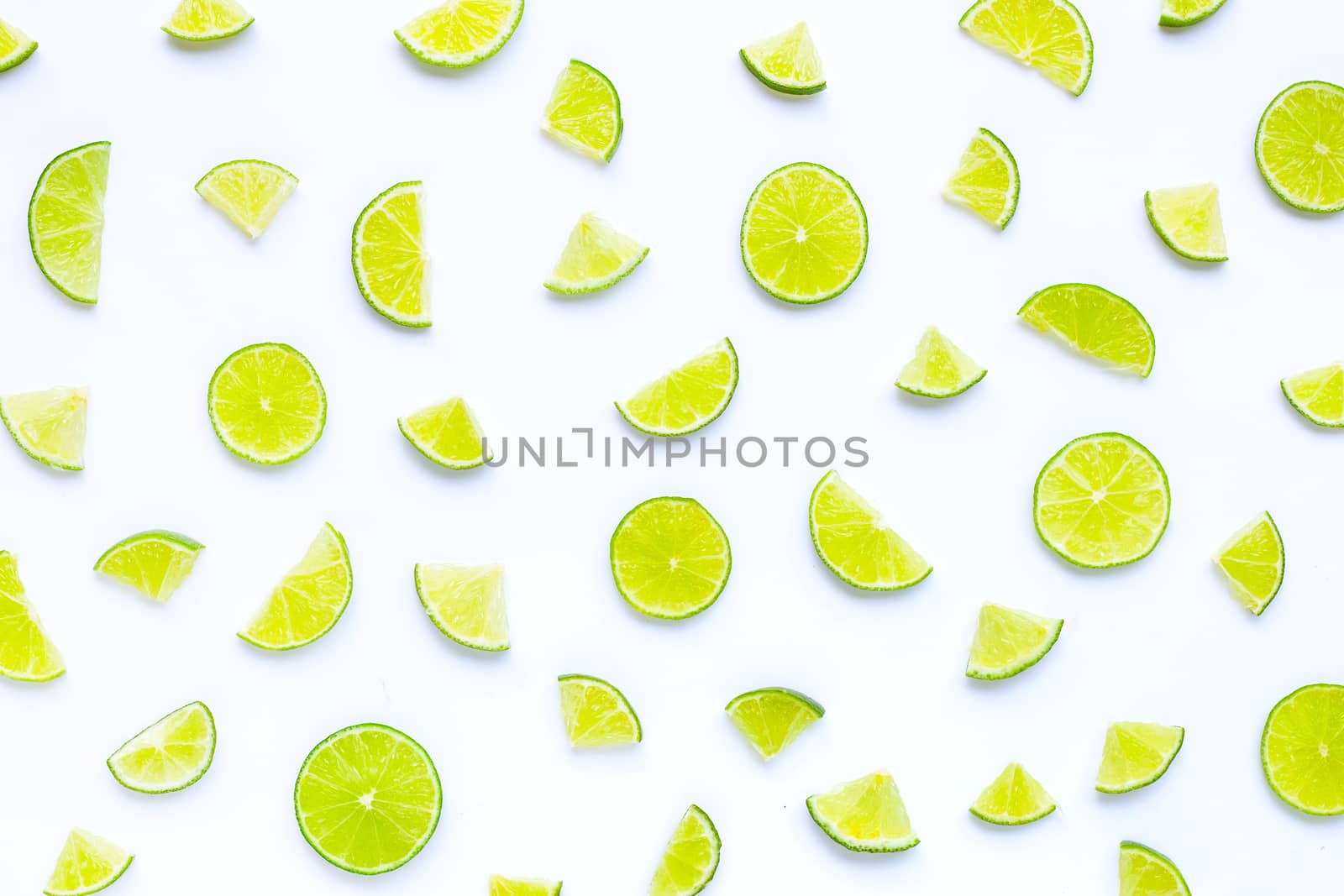Fresh lime slices on white background. Copy space