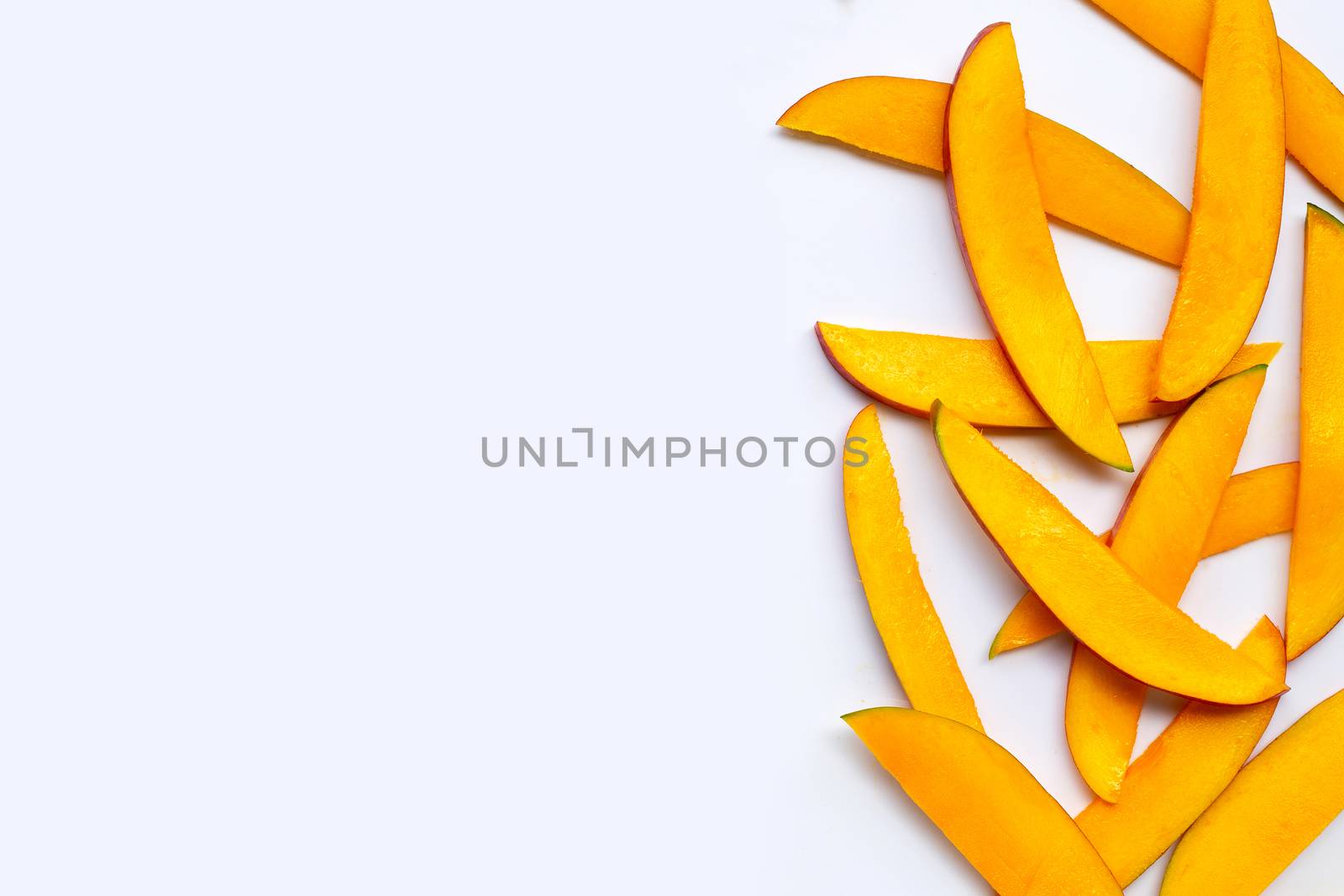 Tropical fruit, Mango slices on white background. Top view
