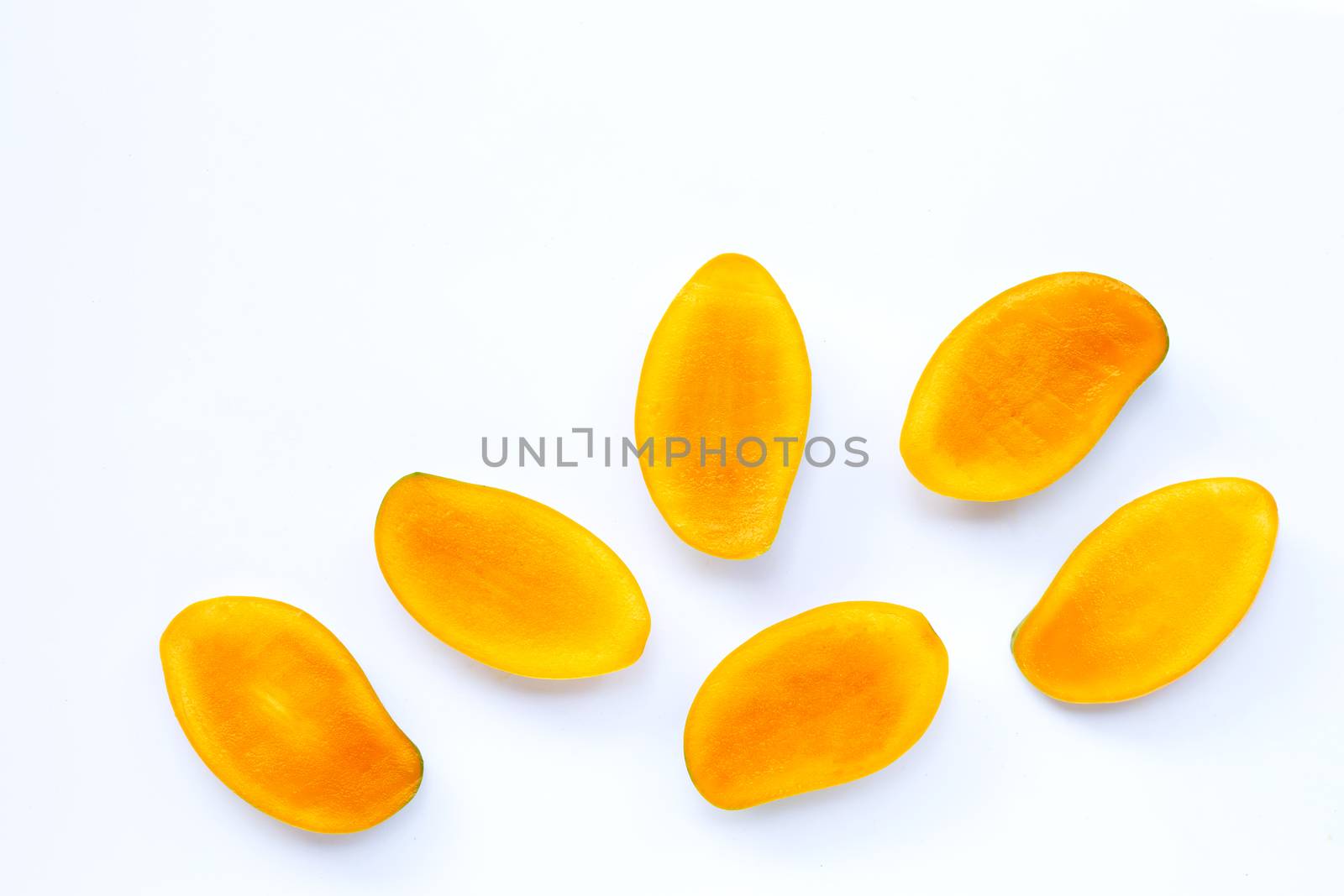 Tropical fruit, Mango slices on white background. Copy space