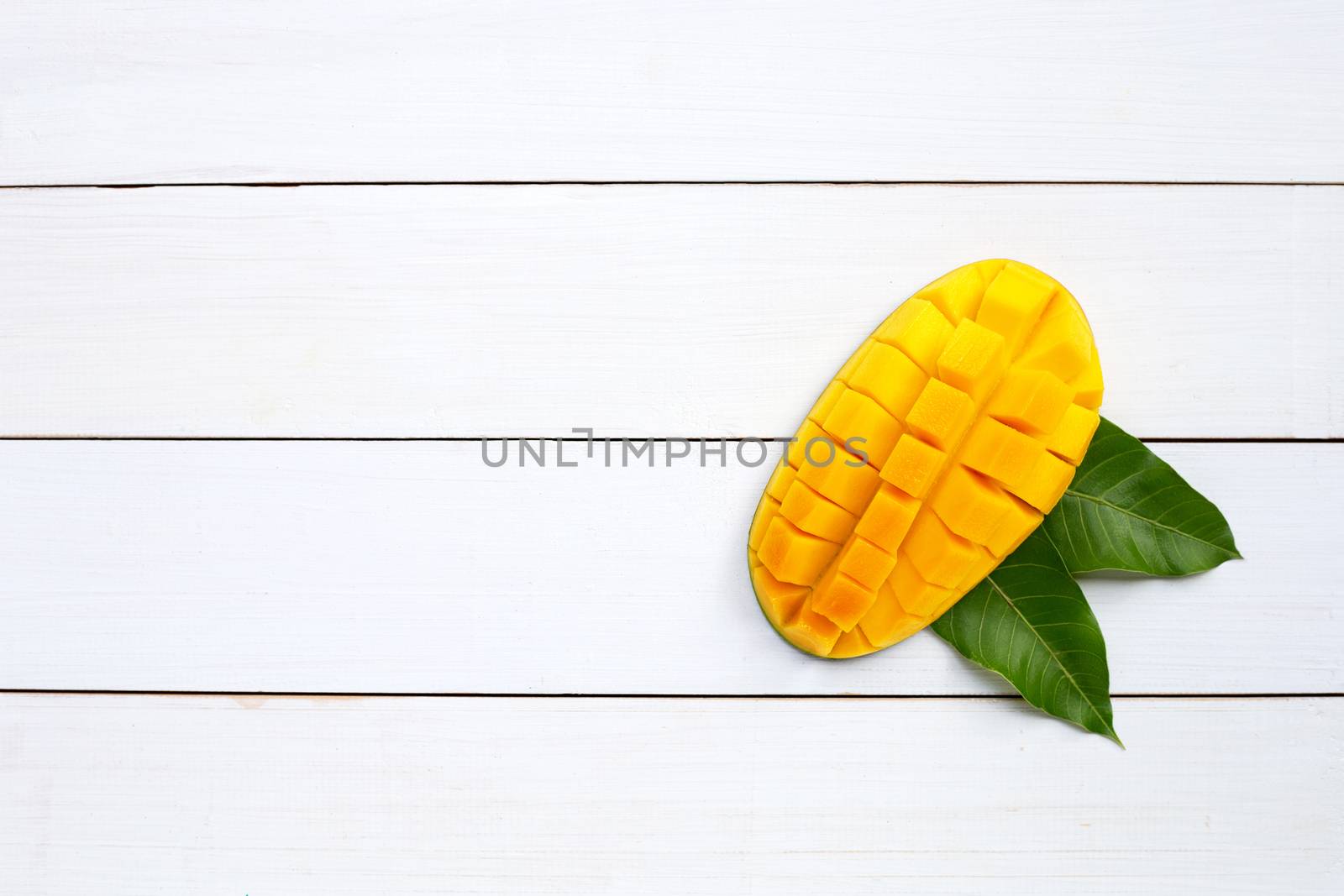 Tropical fruit, Mango  on white wooden background. Top view