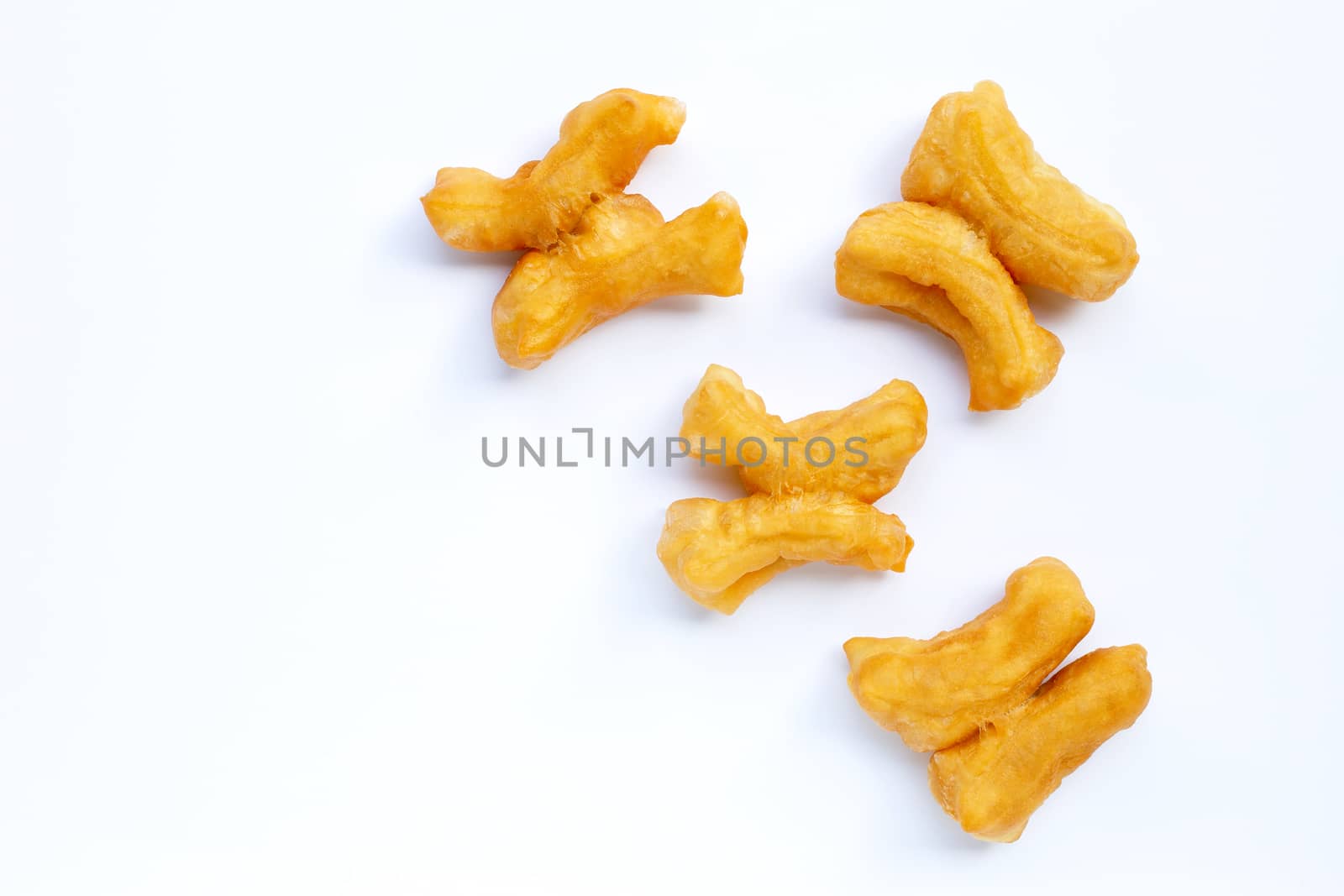 Deep-fried dough stick, chinese bread stick on white background. Copy space