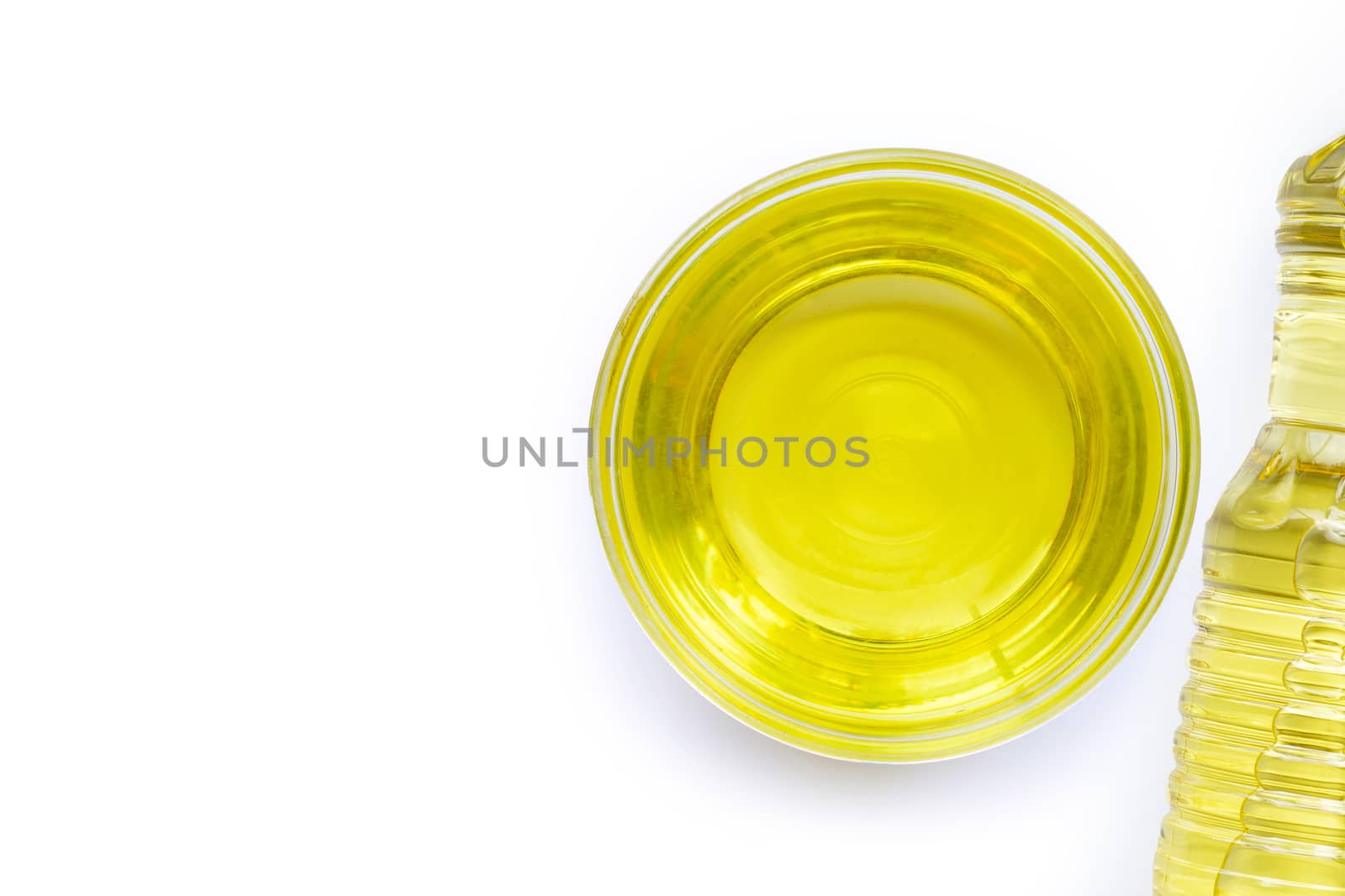 Soybean oil in a glass bowl on white backgraund. Copy space