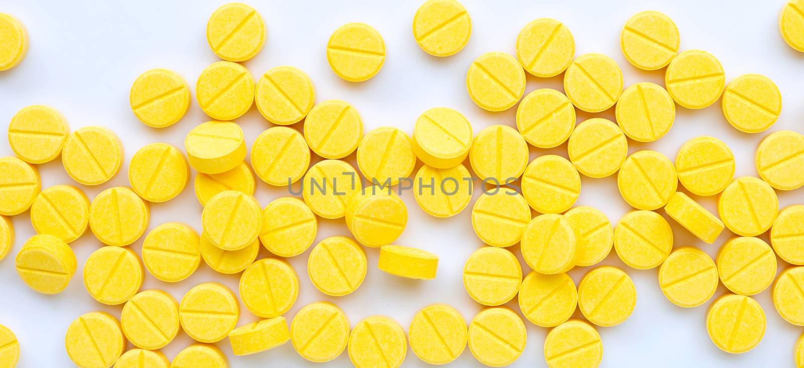 Yellow tablets of Paracetamol on white background.  by Bowonpat