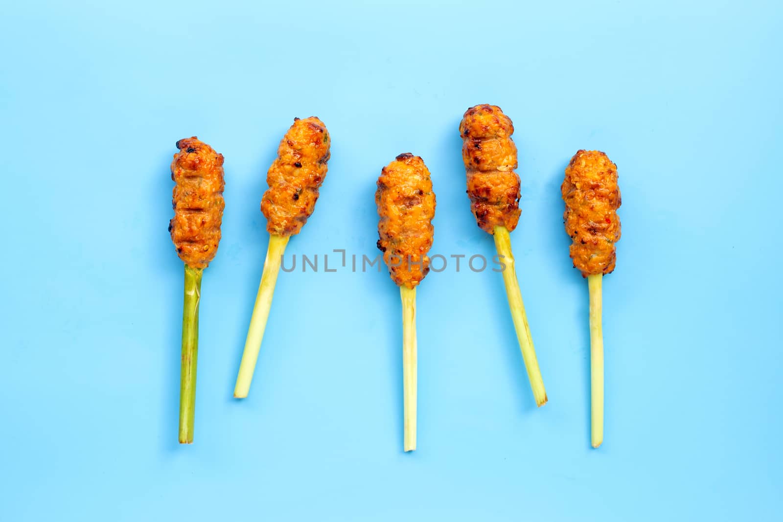 Grilled minced chicken with curry paste and coconut cream on lemongrass skewers.  Top view