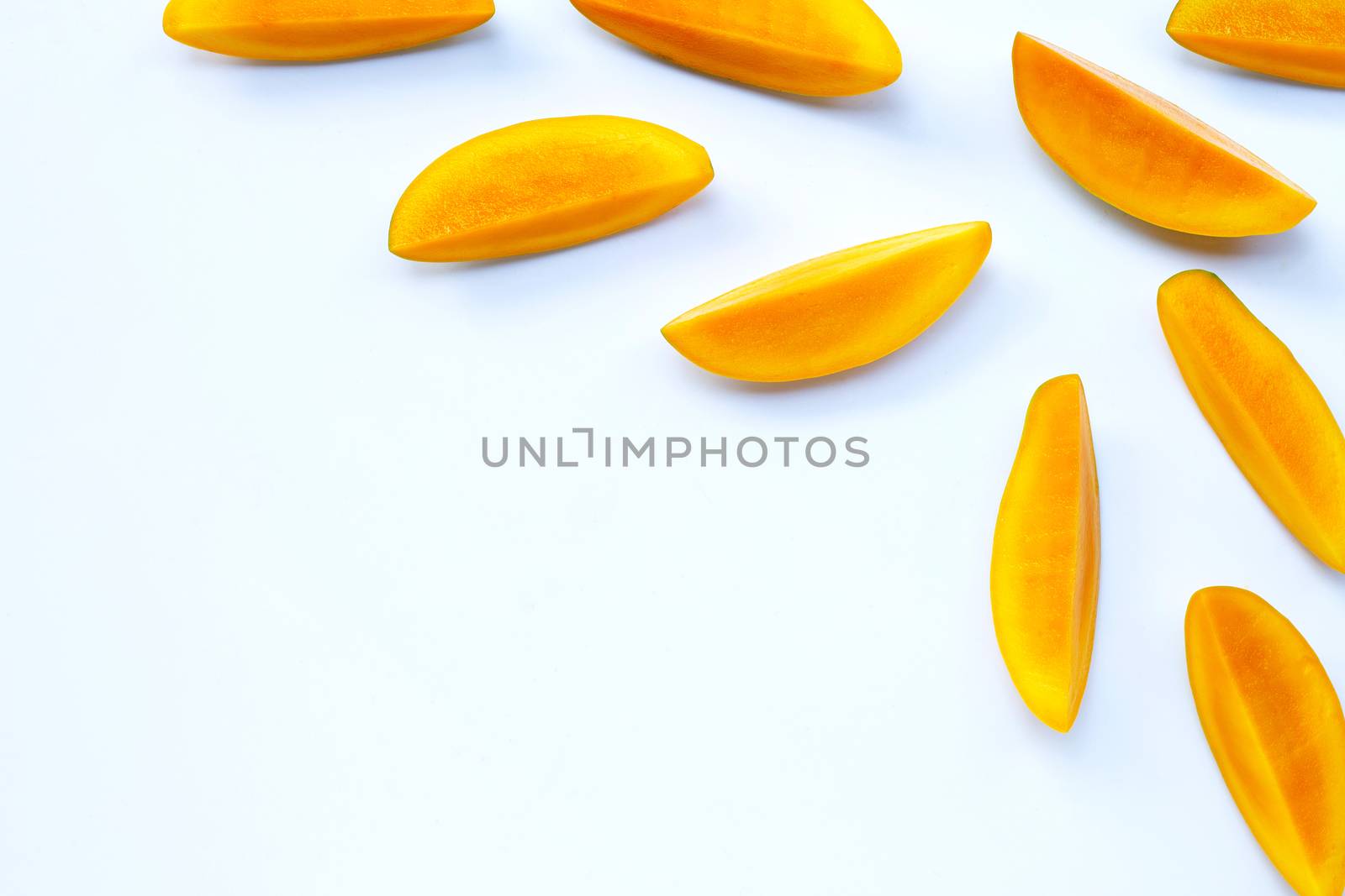 Tropical fruit, Mango  slices on white background. copy space