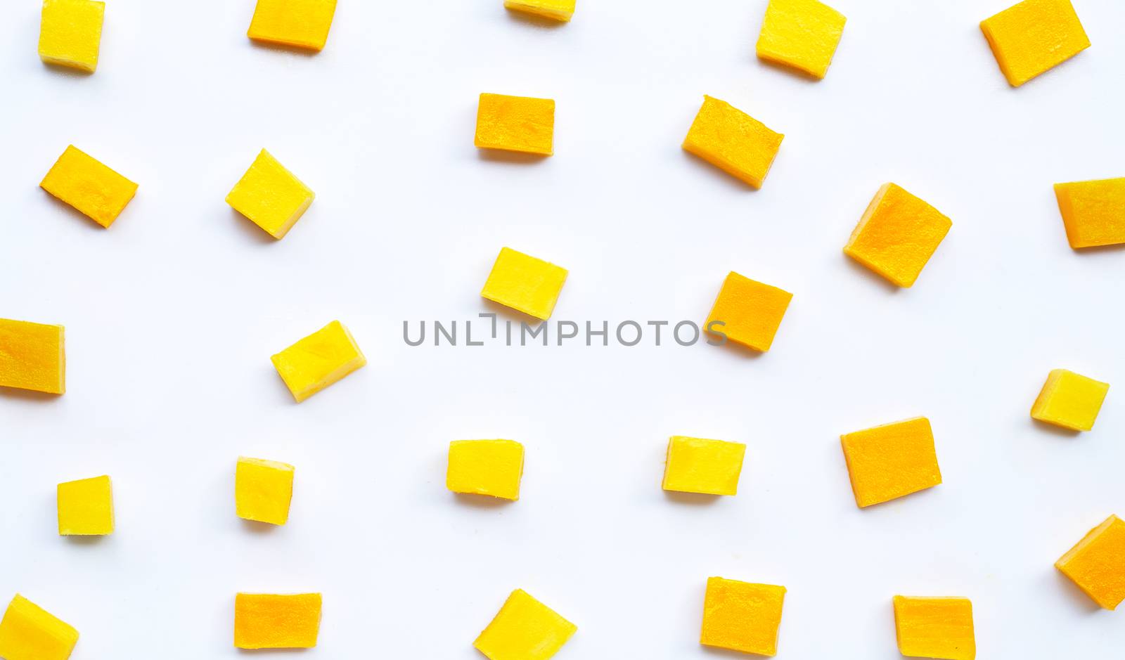 Tropical fruit, Mango cube slices on white background. Top view