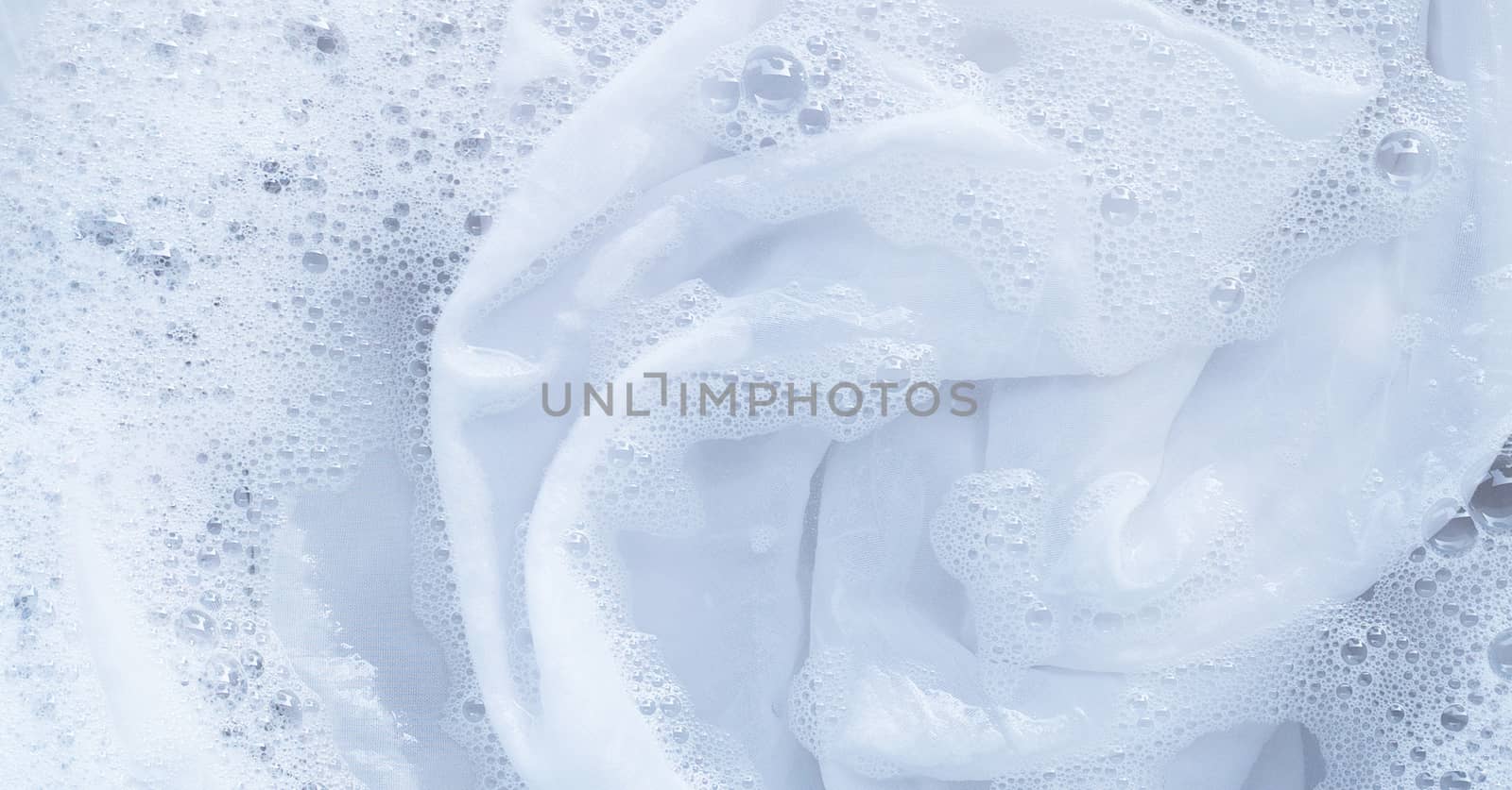 Top view of soak a cloth before washing, white cloth