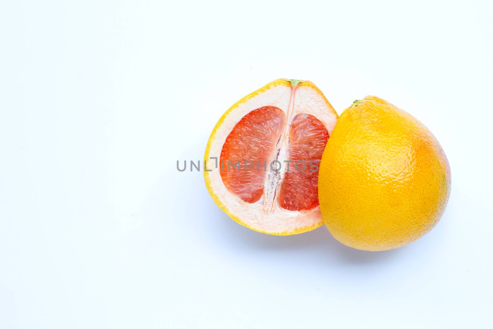 High vitamin C. Juicy grapefruit on white background. Copy space