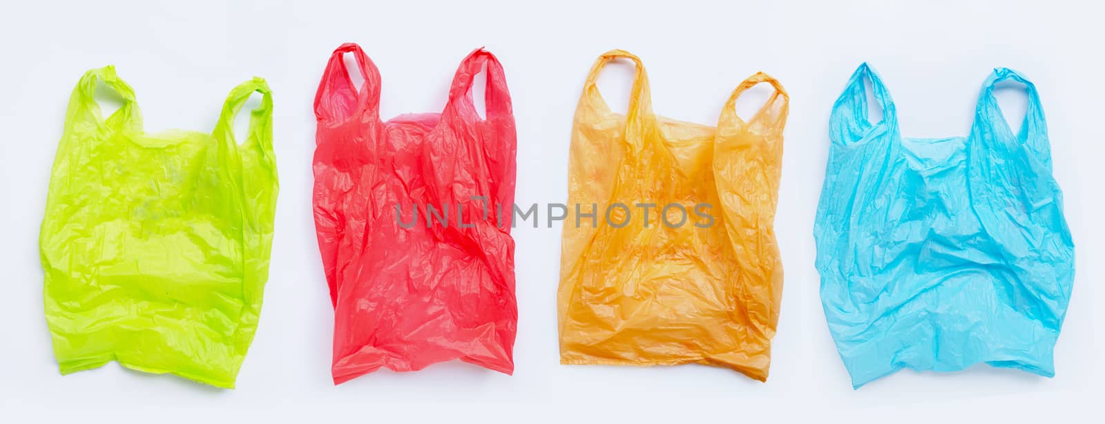 Colorful plastic bags on white background.  by Bowonpat