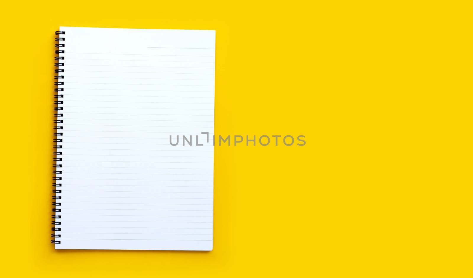 Diary on blue background. Top view with copy space