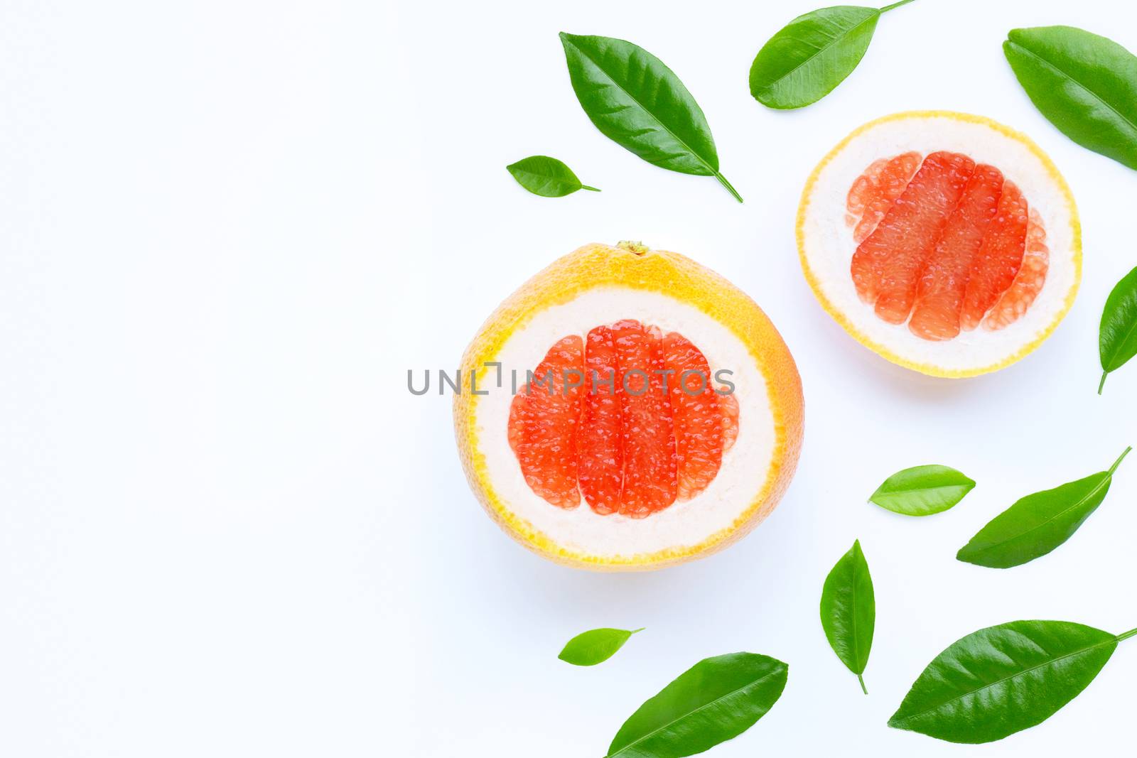 High vitamin C. Juicy grapefruit slices on white background.