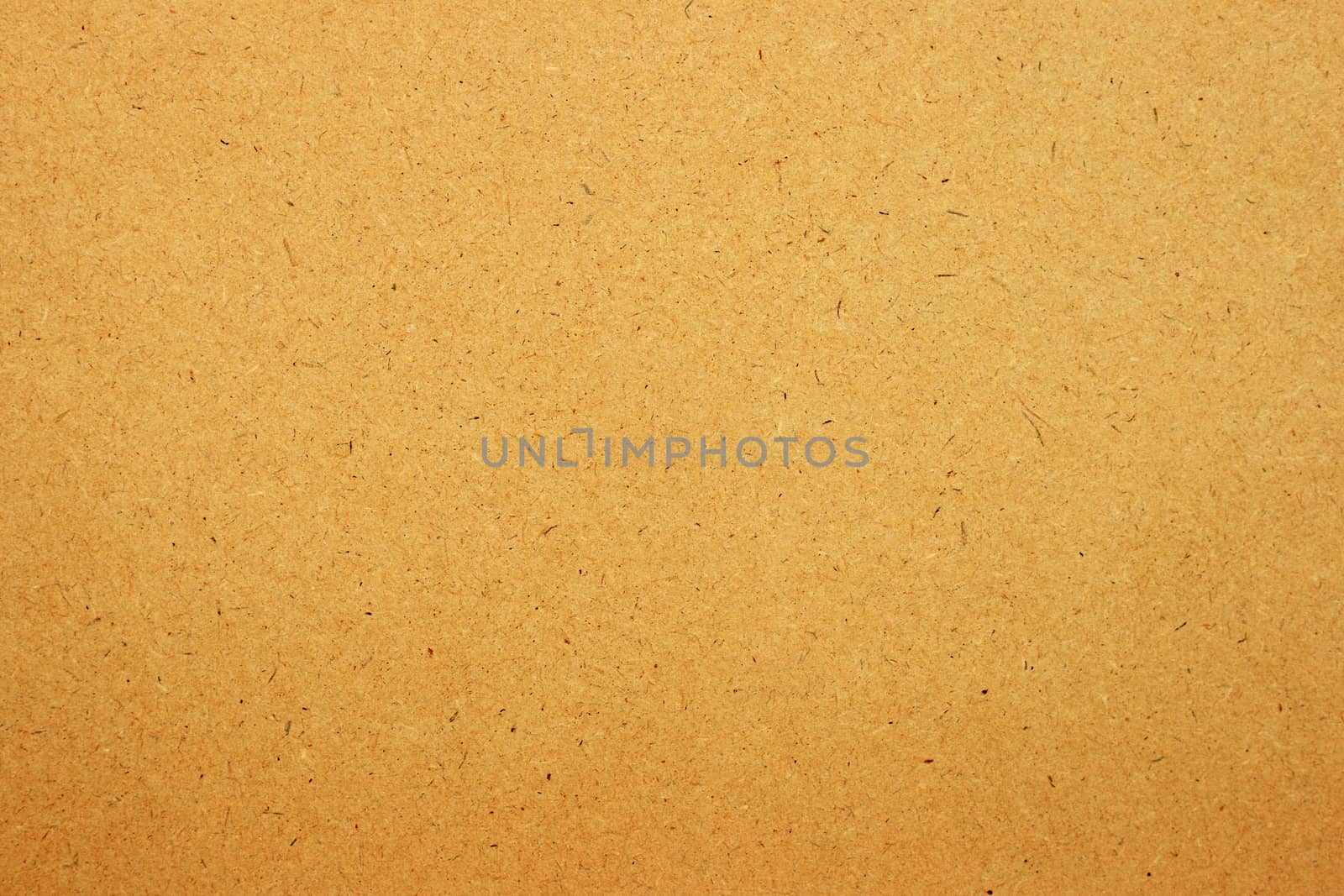Sheet of brown paper or cardboard texture for background.
