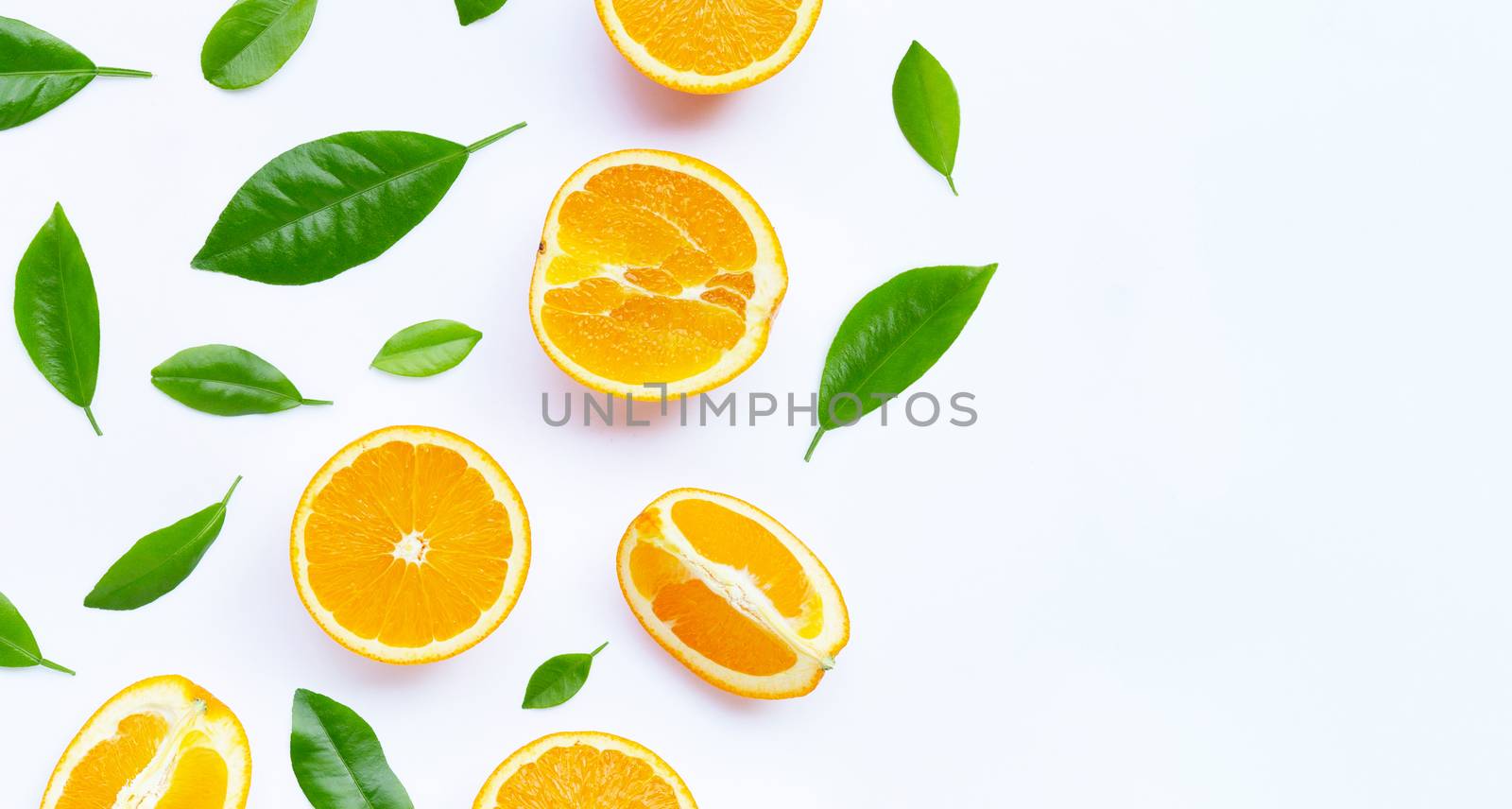 Oranges with leaves on white background. Copy space