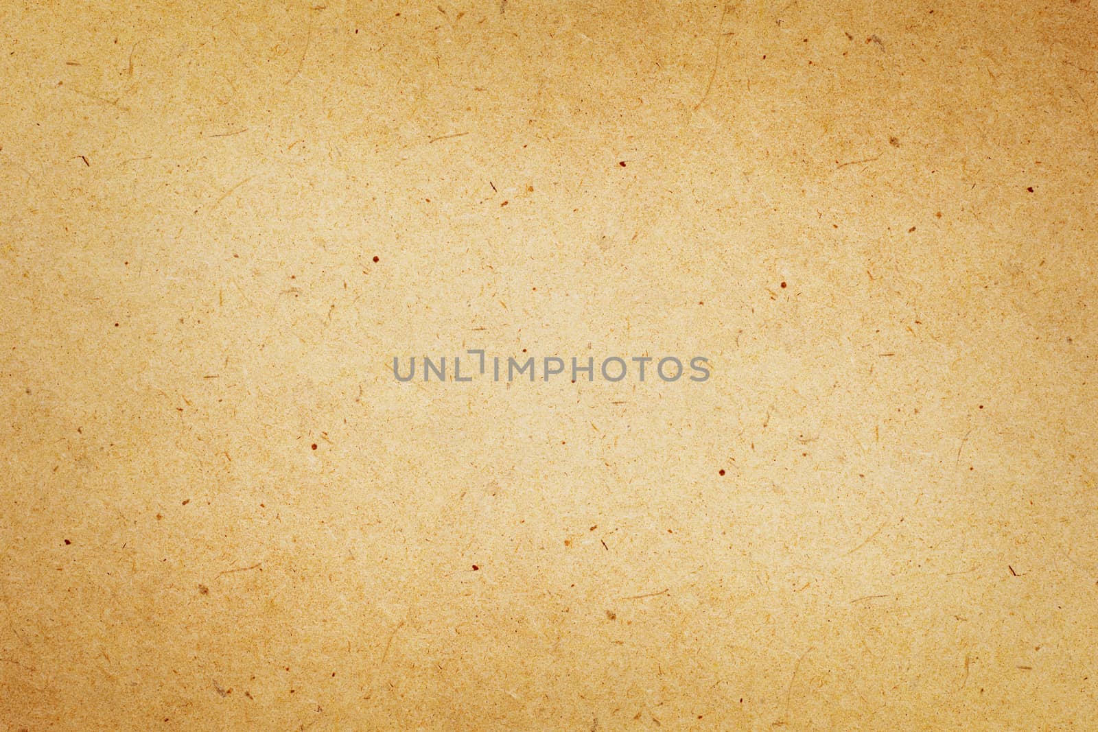 Sheet of brown paper or cardboard texture for background.