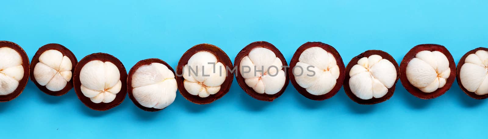 Mangosteen on blue background. Top view