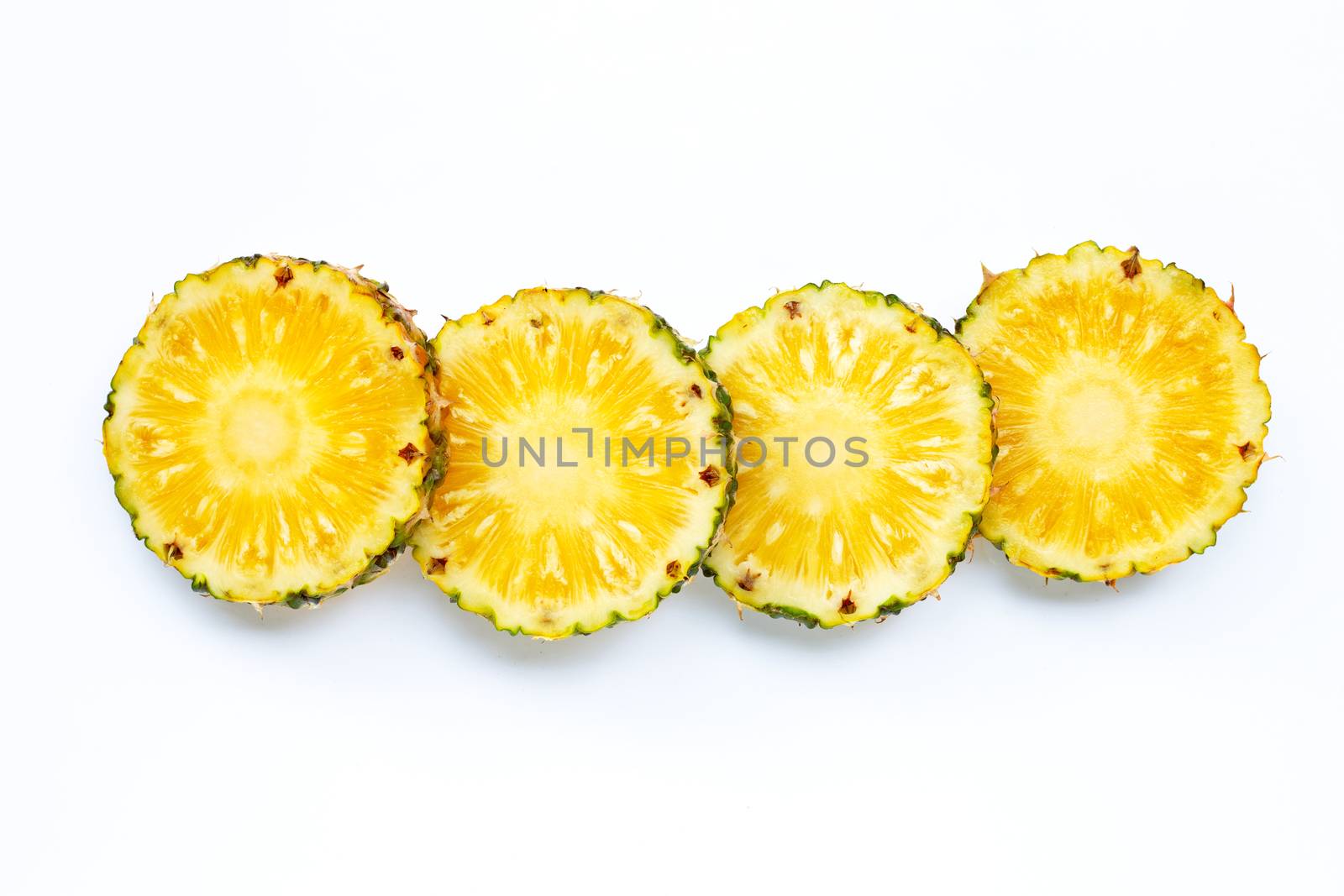 Fresh pineapple slices on white background. Top view