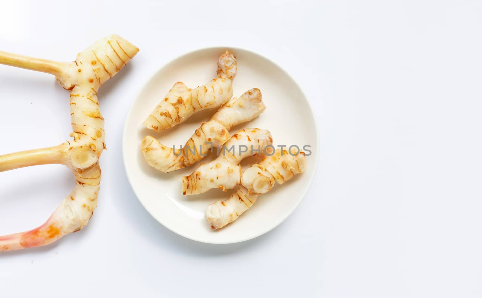 Fresh galangal isolated on white background.